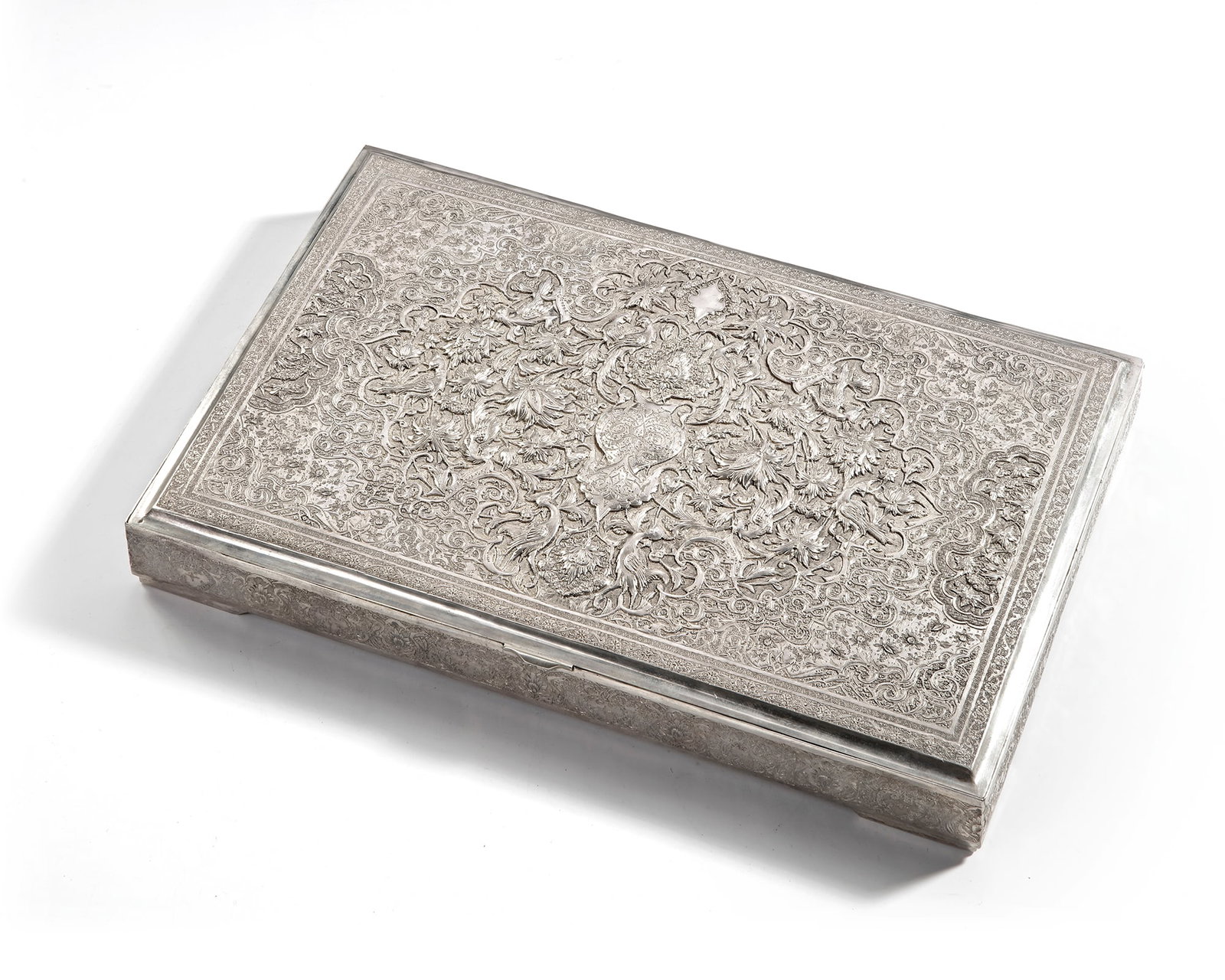 A SILVER BOX, PERSIA, 19TH CENTURY: Finely engraved with dense floral and scroll motifs. The interior richly gilt. 29 by 20 by 4 cm. 1140 gr.