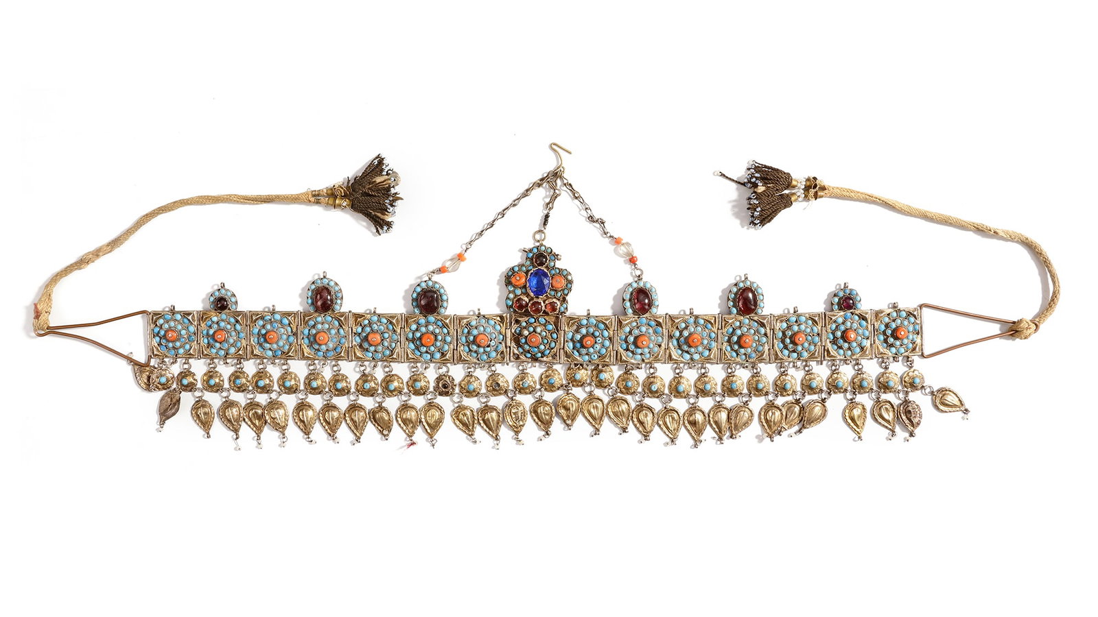 A TADJIK TILLA BARGHAK HEADBAND, 19TH CENTURY: Richly decorated with turquoise and coral in intricate floral patterns, complemented by dangling gilt ornaments. 35 cm in length. 102 gr.