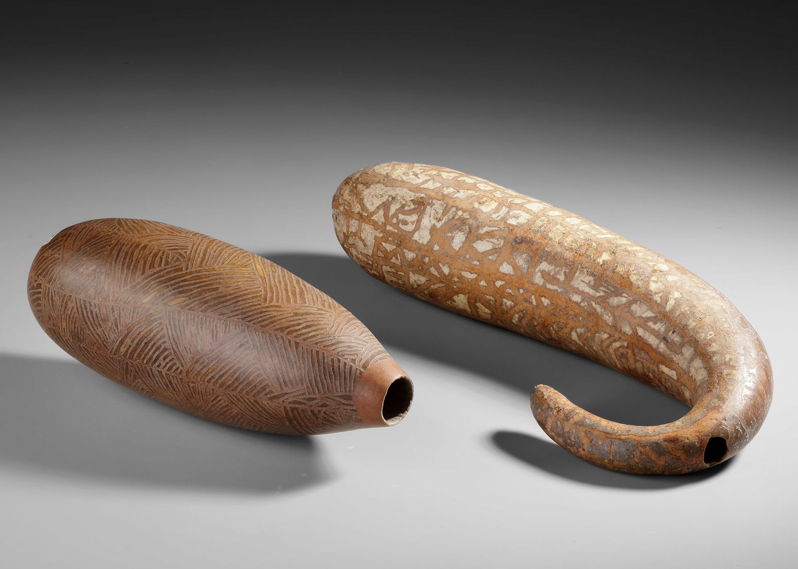 Two large gourd water containers from the Baliem valley (Dani): Two large gourd water containers from the Baliem valley (Dani). Collected by Jac Hoogerbrugge in the 1960’s.1. ca. 39 cm. 2. ca. 33 cm.