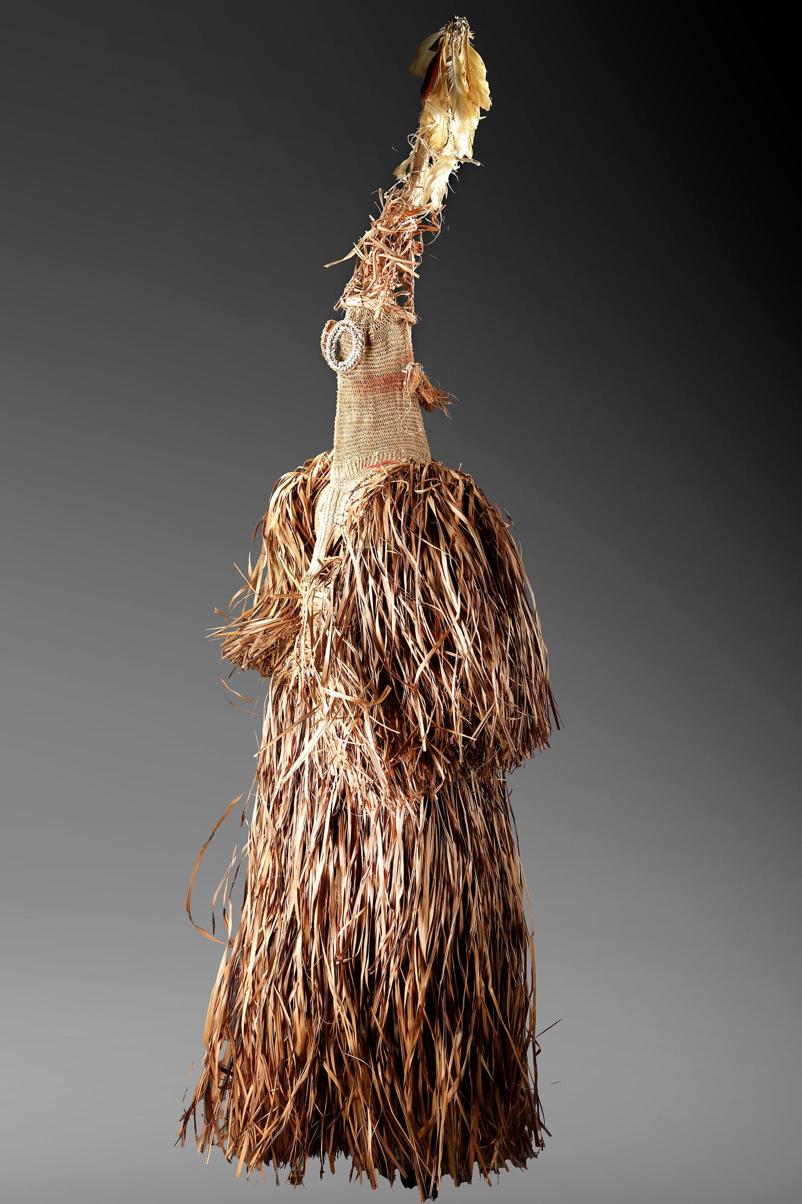 Asmat. Dancing costume “Jipae??. Collected by Jac Hoogerbrugge in the 1960’s or 1970’s.: Used in a ceremony performed in order to urge the spirits of recently deceased people to leave the community and travel tot he world of the ancestors.ca.160 by 60