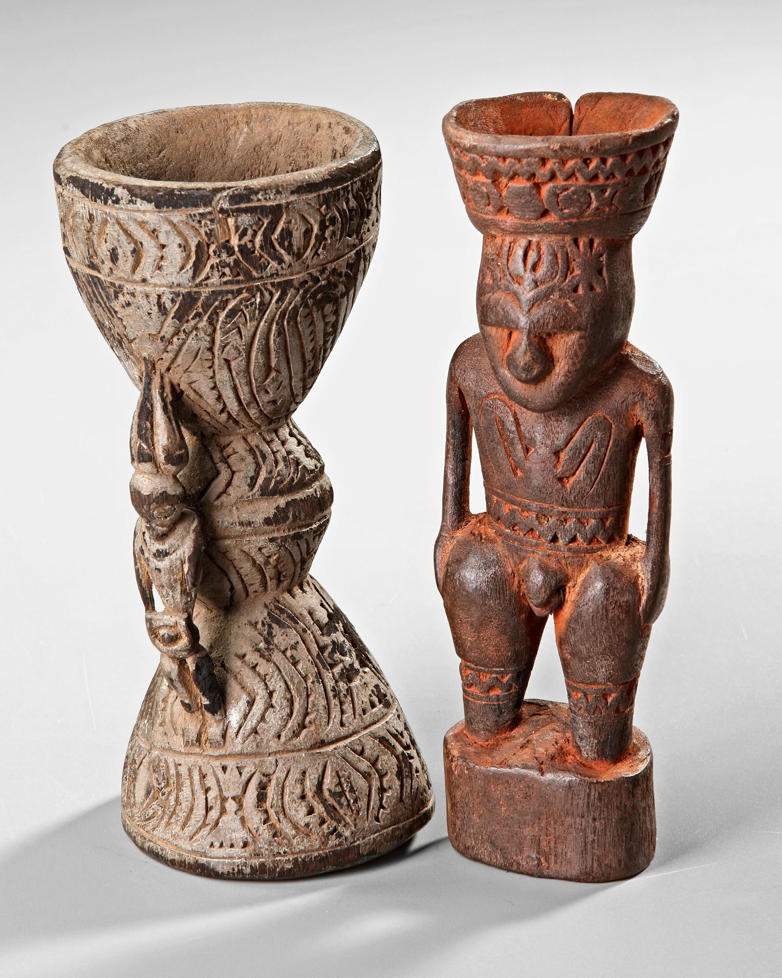 Two Sepik betel nut mortars.: 1. 16 cm. 2. 18 cm.
