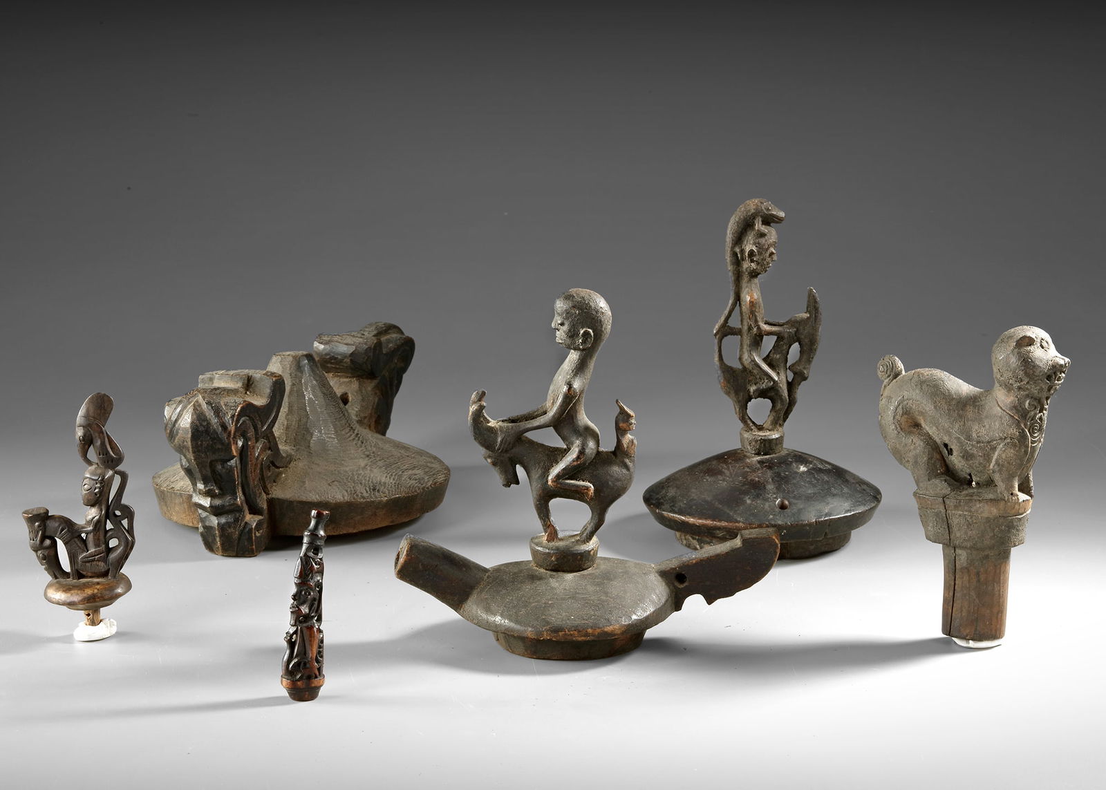 Sumatra. A collection of Batak lids and stoppers.: All collected by Jac Hoogerbrugge in the 1950’s.Big one : ca. 27 by 17 cm. small one : ca. 17 by 10 cm.