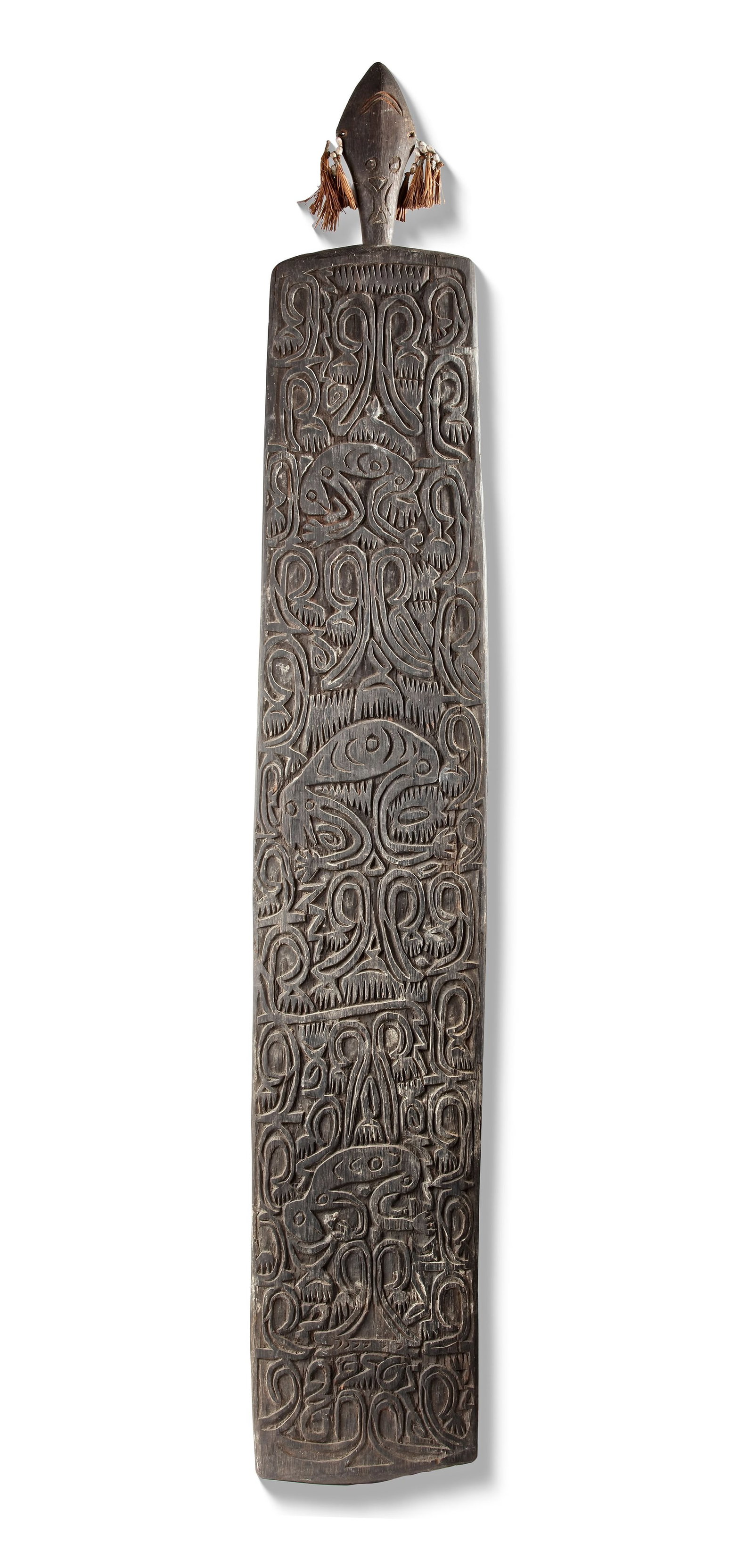 Asmat panel with typical designs collected by Jac Hoogerbrugge.: 121 by 20 cm.