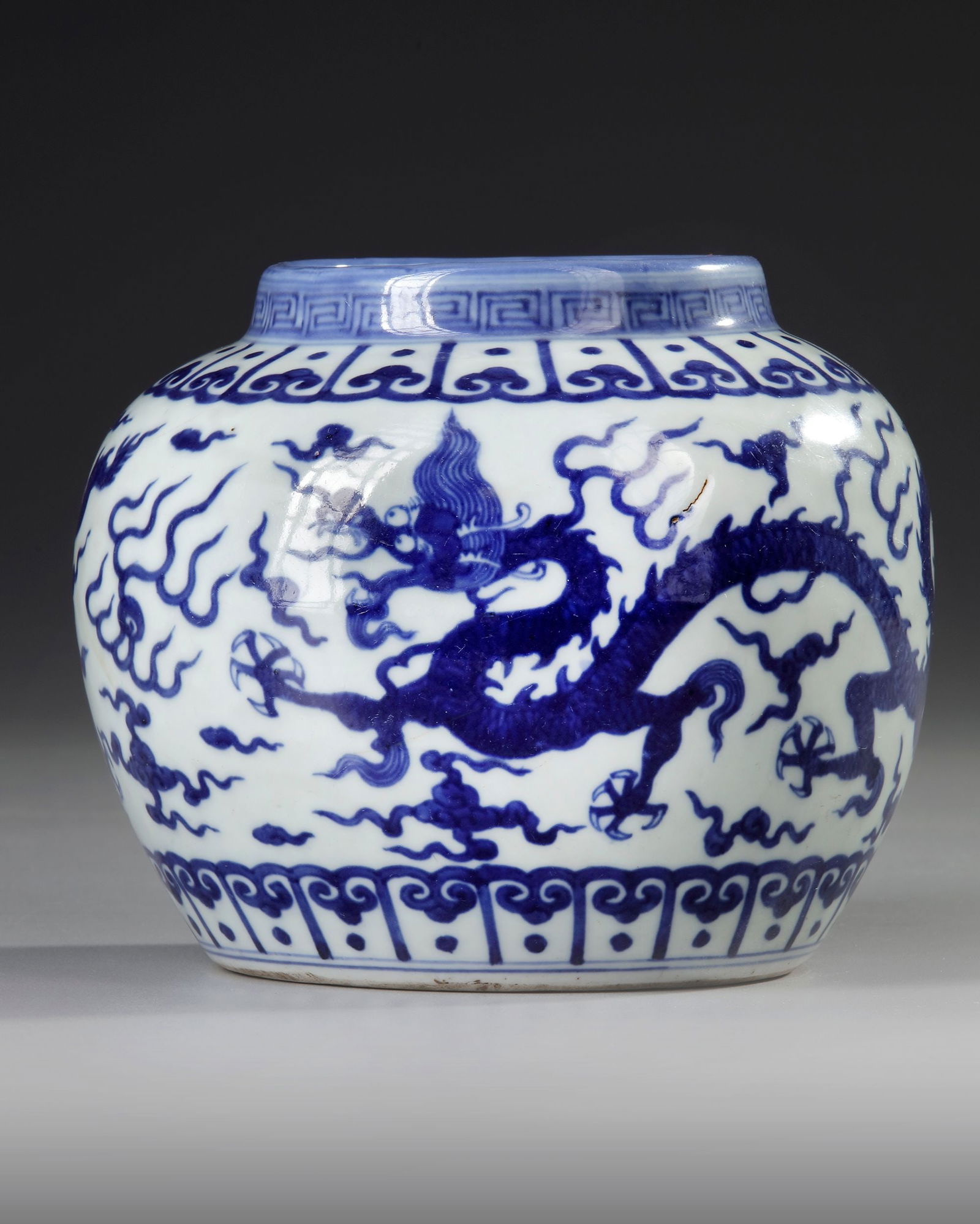 A CHINESE BLUE AND WHITE DRAGONS JAR, QING DYNASTY (1644-1911) (1 of 4)