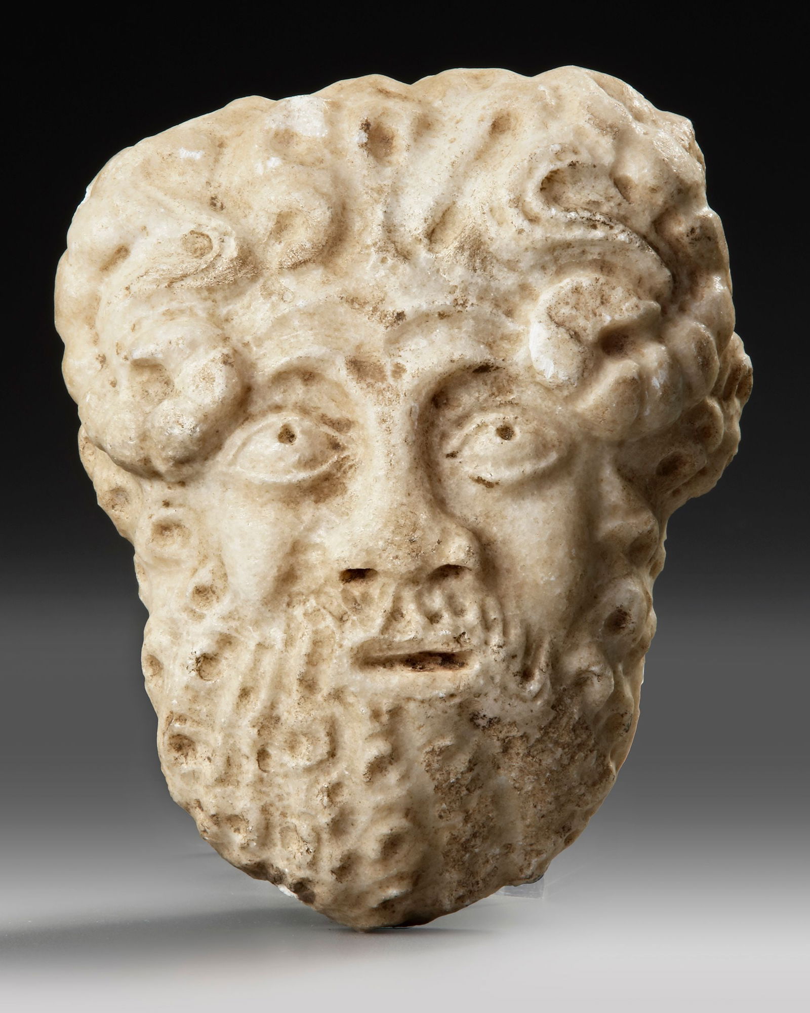 A ROMAN MARBLE HEAD OF SATYR, 2ND CENTURY AD (1 of 3)