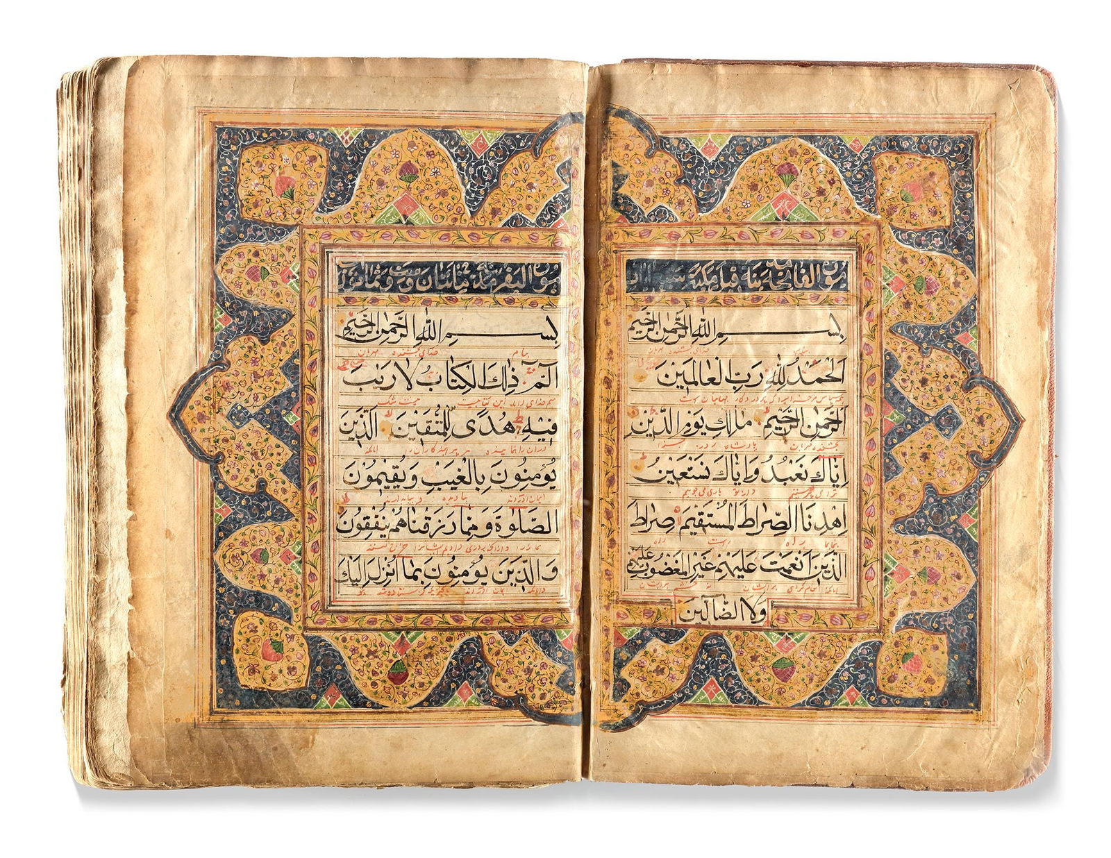 AN EARLY QAJAR ILLUMINATED QURAN, PERSIA, EARLY 19TH CENTURY: Arabic manuscript on paper, each folio with 11 lines of elegant largevblack naskh script, diacritics and vowels in red. Persian interlinear translation in red nastaliq, marginal occasional notes indic