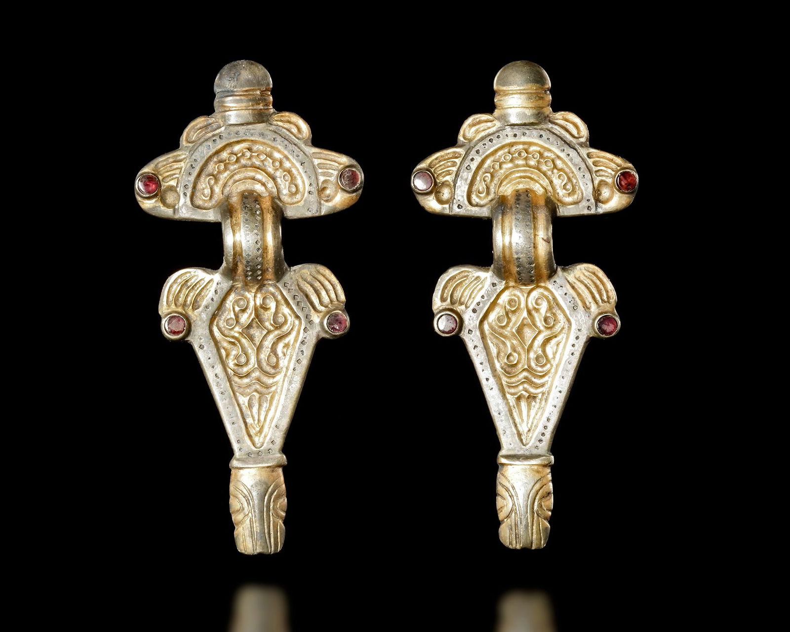 A PAIR OF THURINGIAN GILT SILVER RADIATE-HEADED BROOCHES, 5TH-6TH CENTURY AD, (1 of 3)