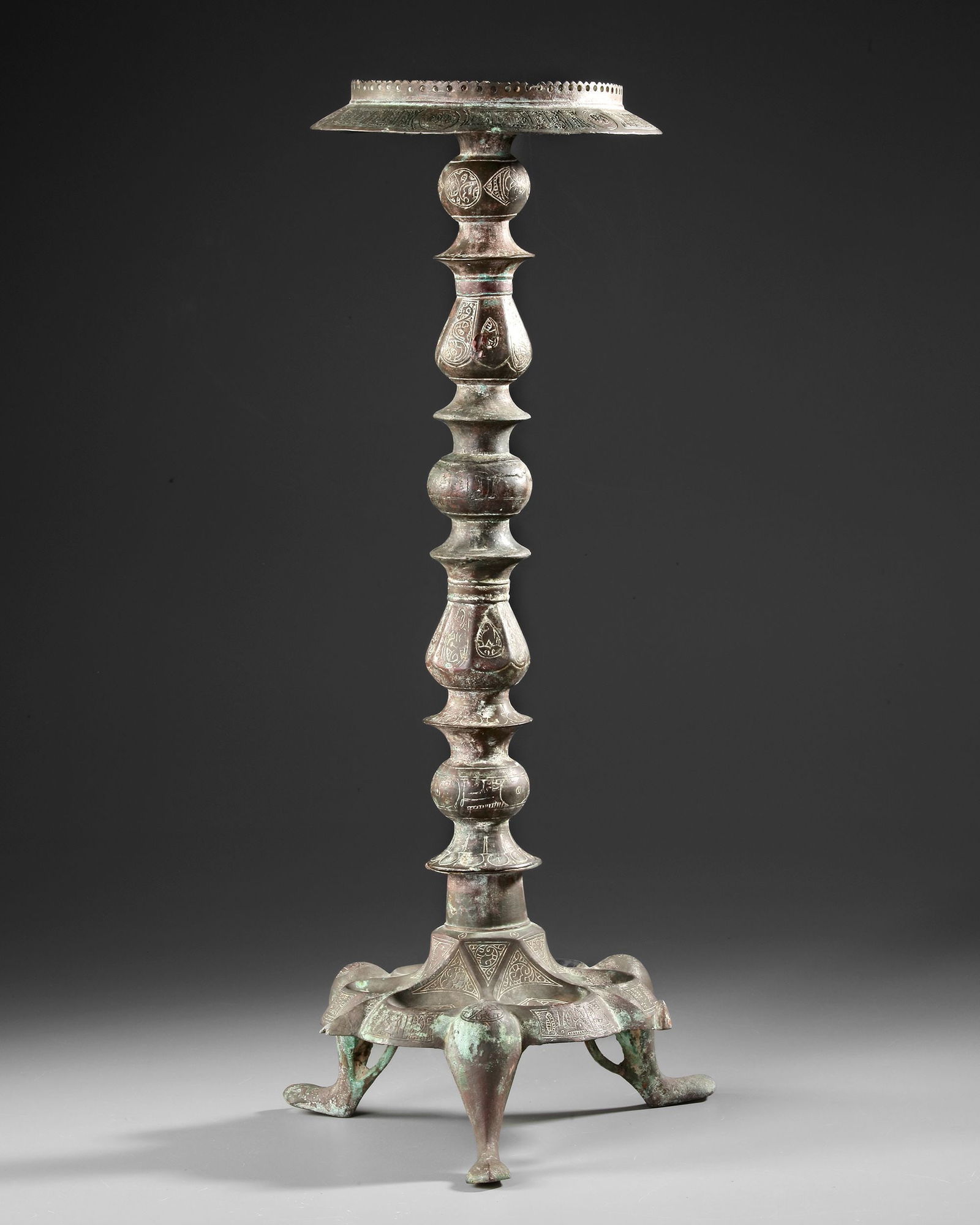 A KHORASAN COMPOSITE BRONZE LAMP STAND, PERSIA, 12TH CENTURY (1 of 3)