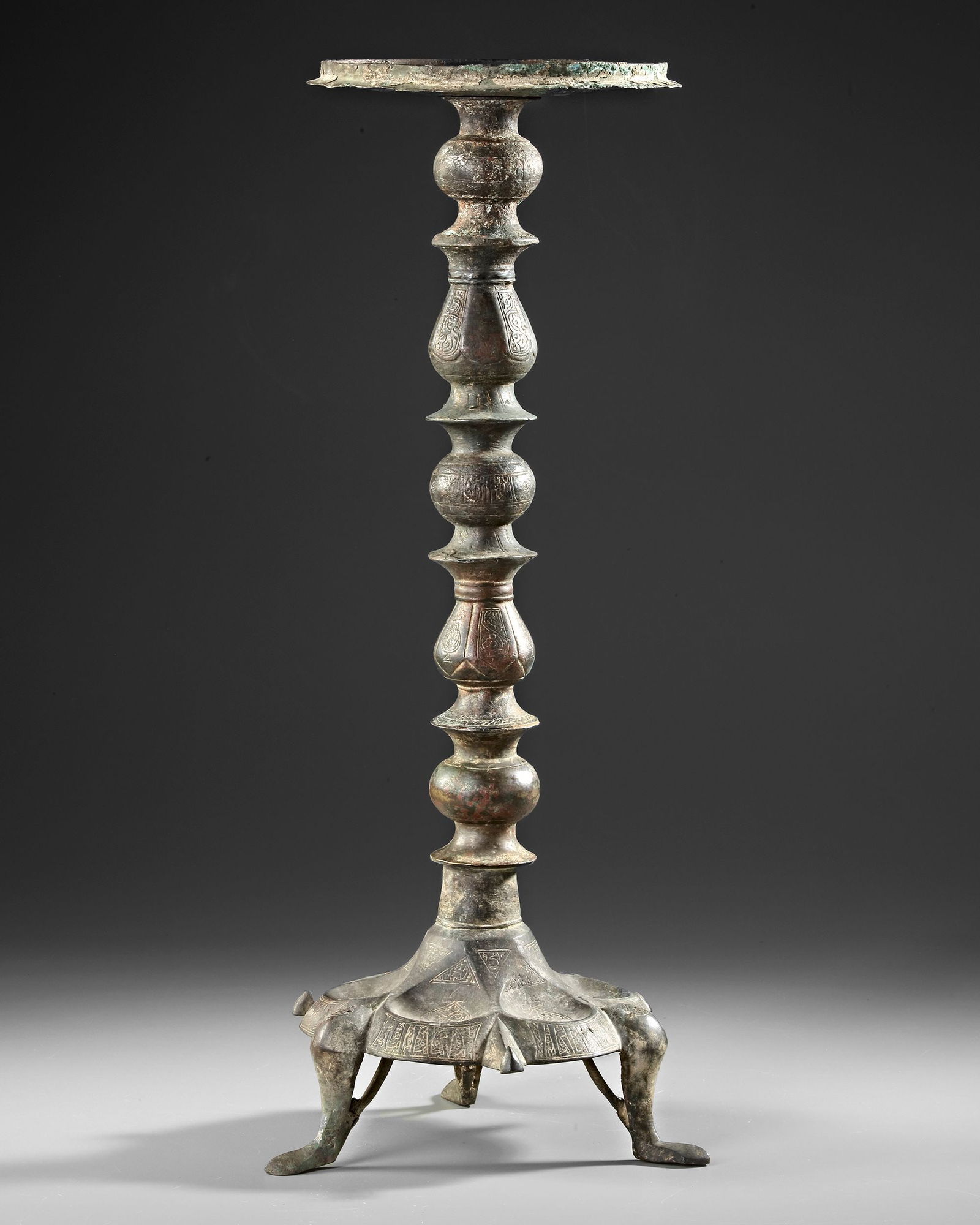 A KHORASAN COMPOSITE BRONZE LAMP STAND, PERSIA, 12TH CENTURY (1 of 3)