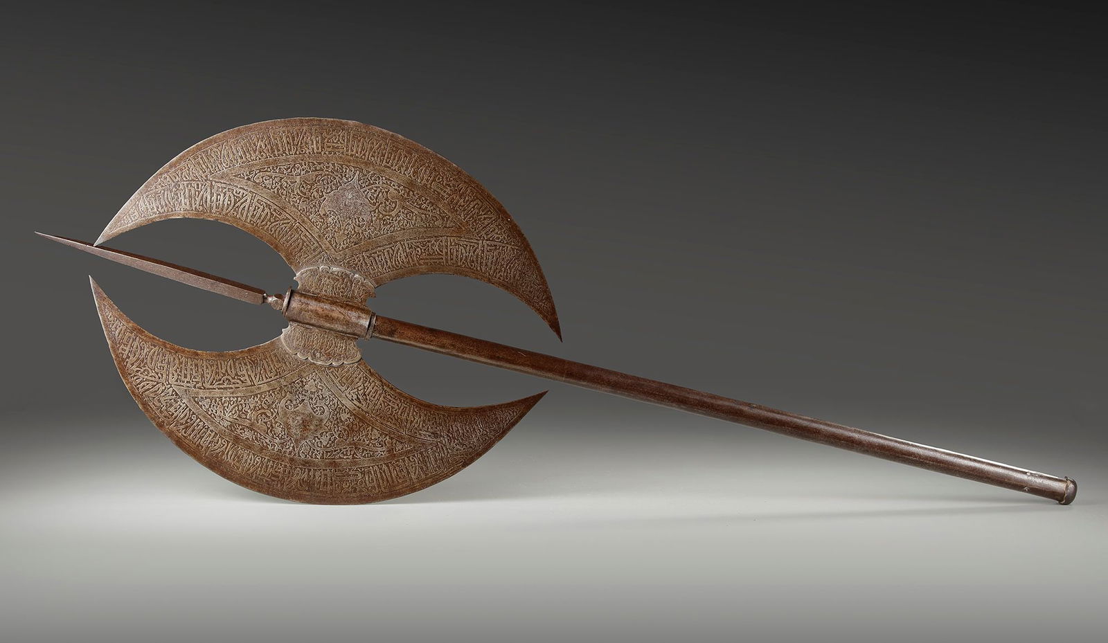 A LARGE QAJAR DOUBLE HEAD AXE, PERSIA, 19TH CENTURY (1 of 3)