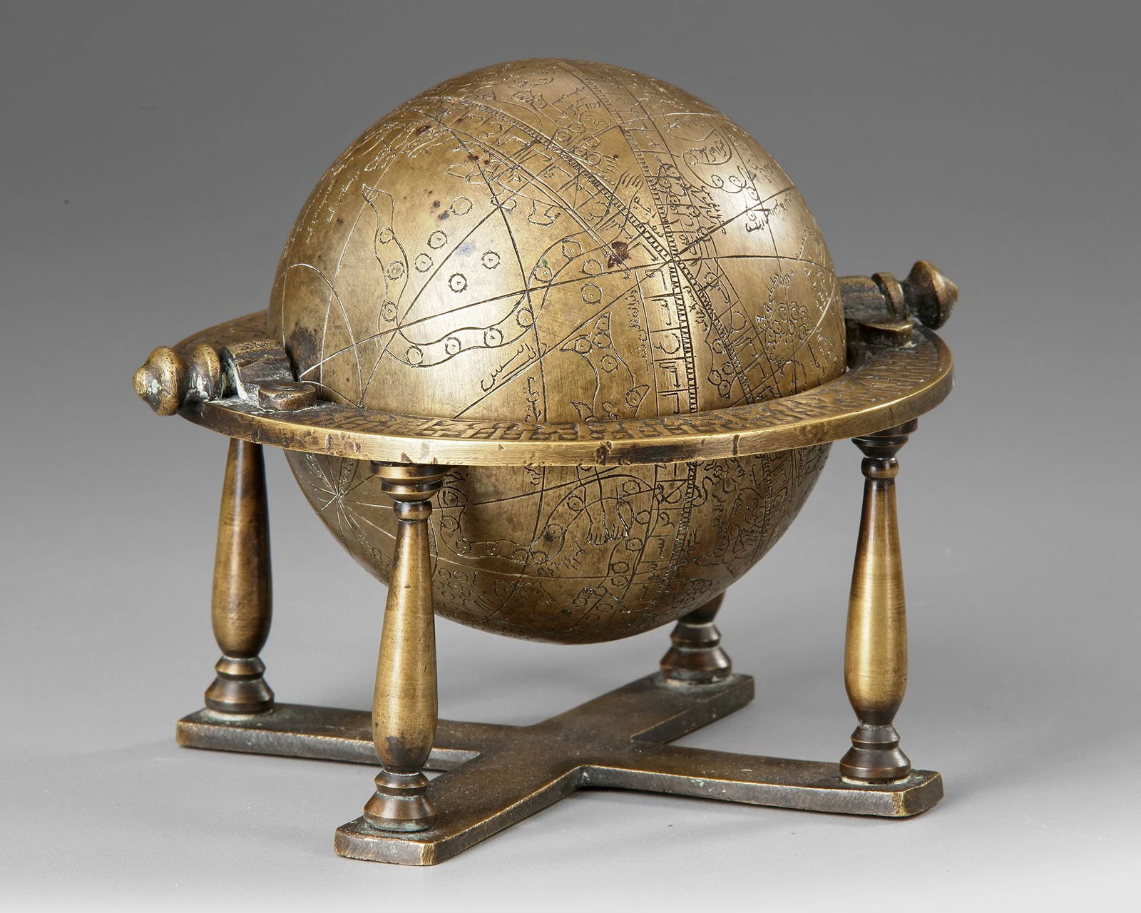 AN INDO-PERSIAN BRASS EASTERN ISLAMIC CELESTIAL GLOBE, 19TH CENTURY (1 of 2)