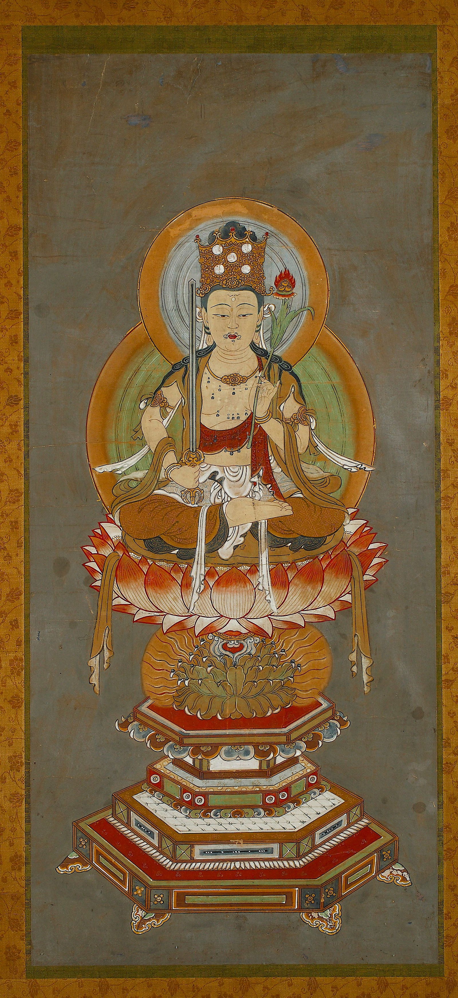 A JAPANESE PAINTING OF MANJUSHRI, 19TH CENTURY: Framed painting, ink and color on silk. Width 40 cm. Height 90 cm.