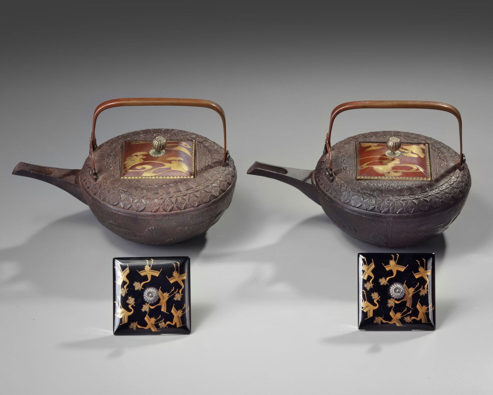 A PAIR OF JAPANESE SAKE-KETTLES, MEIJI PERIOD (1868-1912): Height 15 cm. Width 23 cm.