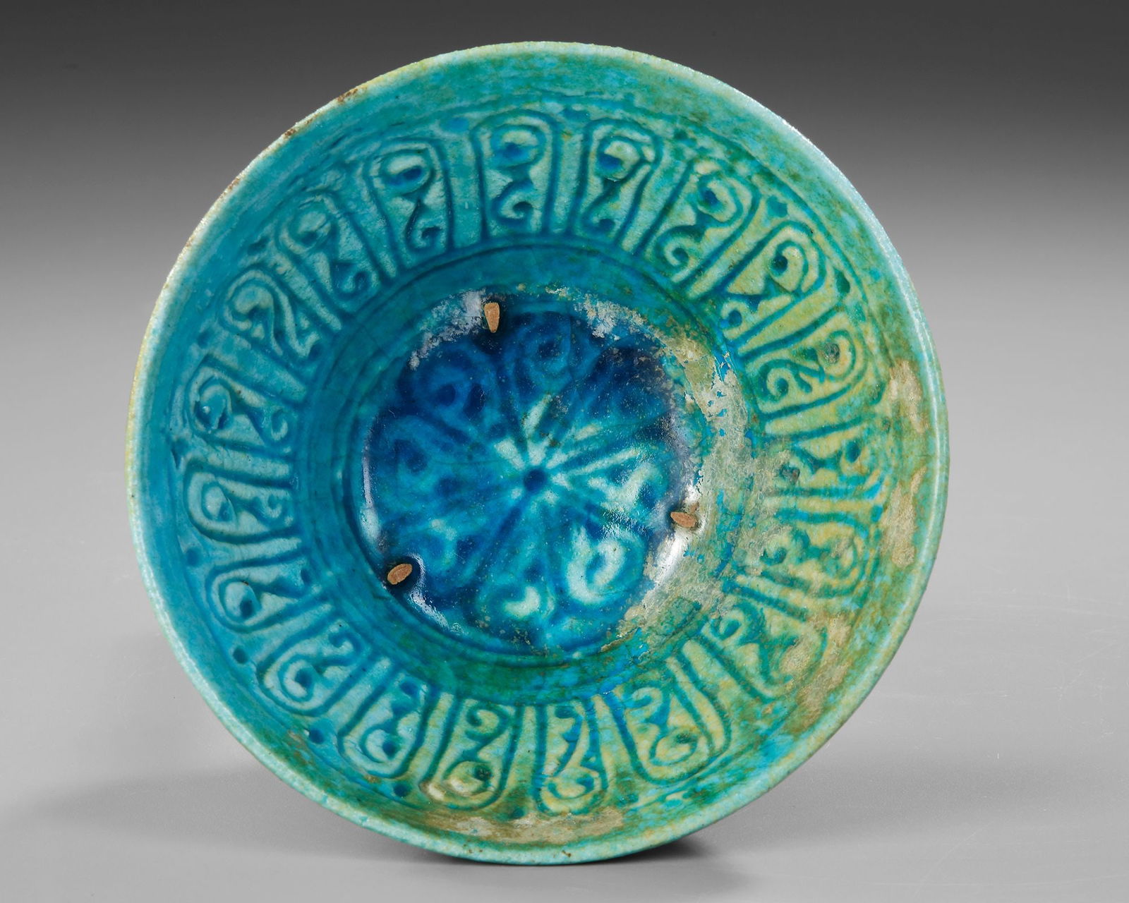 A BAMIYAN MONOCHROME MOULDED POTTERY BOWL, PERSIA, 12TH- 13TH CENTURY (1 of 4)