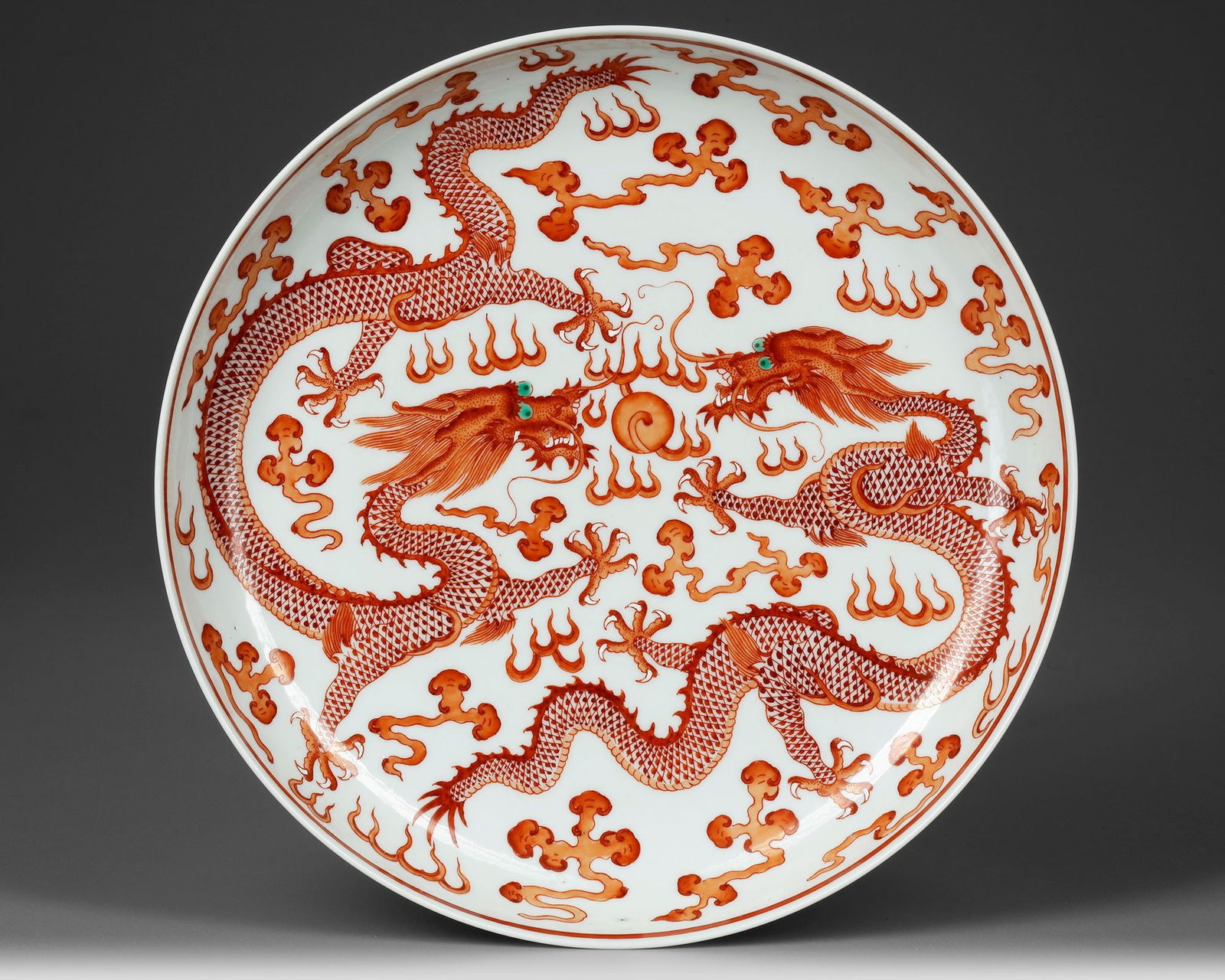 A CHINESE IRON-RED-DECORATED DRAGON DISH, 19TH-20TH CENTURY (1 of 2)