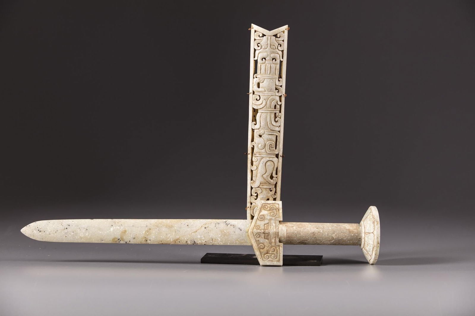 A CHINESE JADE AND HARDSTONE SWORD WITH AN OPENWORK SCABBARD, QING DYNASTY (1644-1911) (1 of 3)