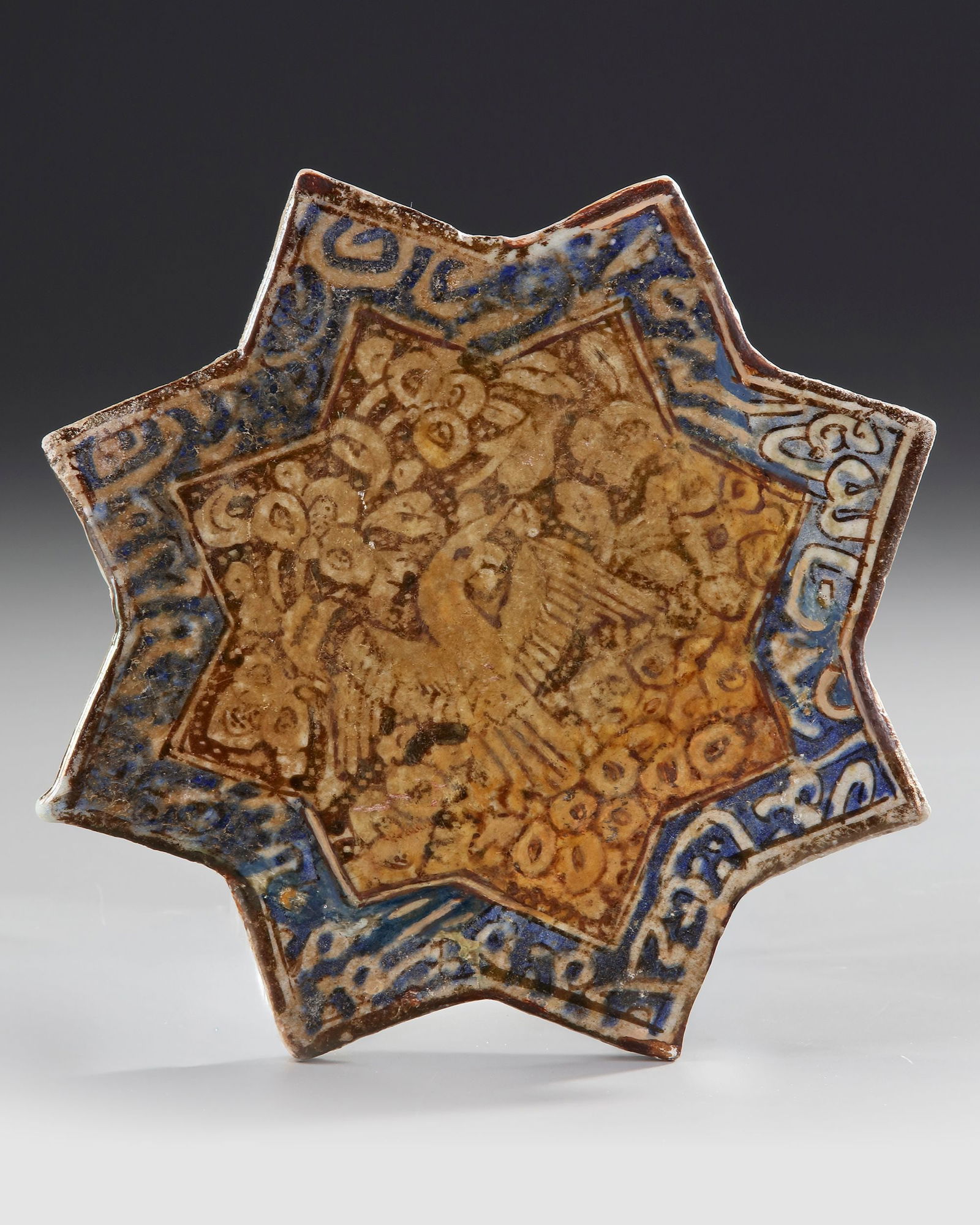 A STAR-SHAPED KASHAN TILE, PERSIA, 13THâ€“14TH CENTURY (1 of 1)