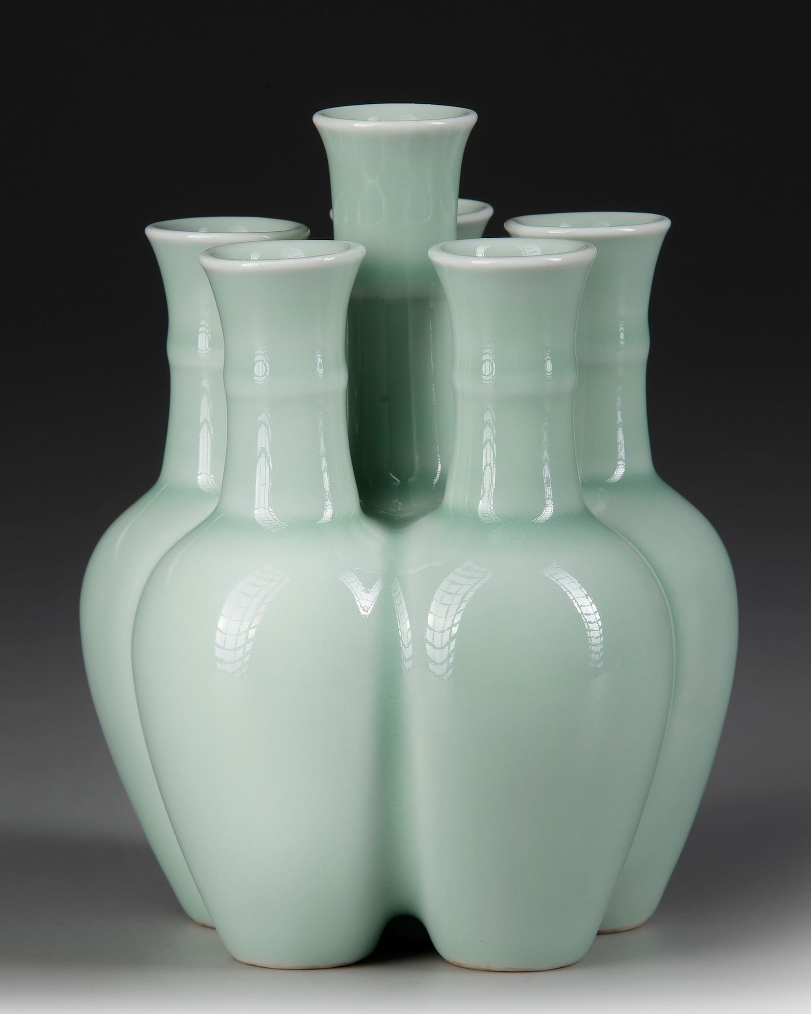 A CHINESE CELADON-GLAZED CONJOINED VASE, QING DYNASTY (1644-1912) (1 of 4)