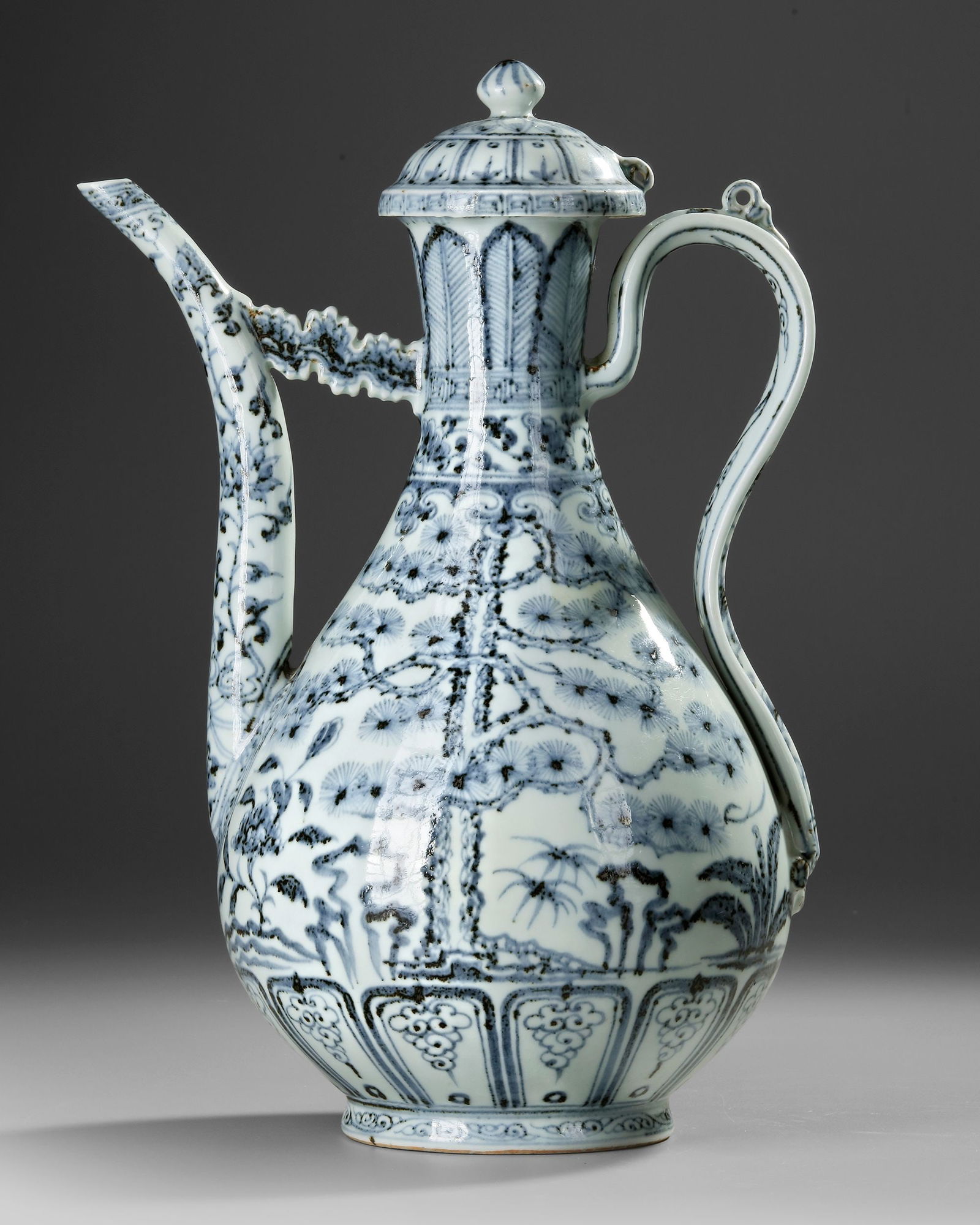 A CHINESE BLUE AND WHITE 'THREE FRIENDS OF WINTER' EWER, QING DYNASTY (1644-1911) (1 of 4)