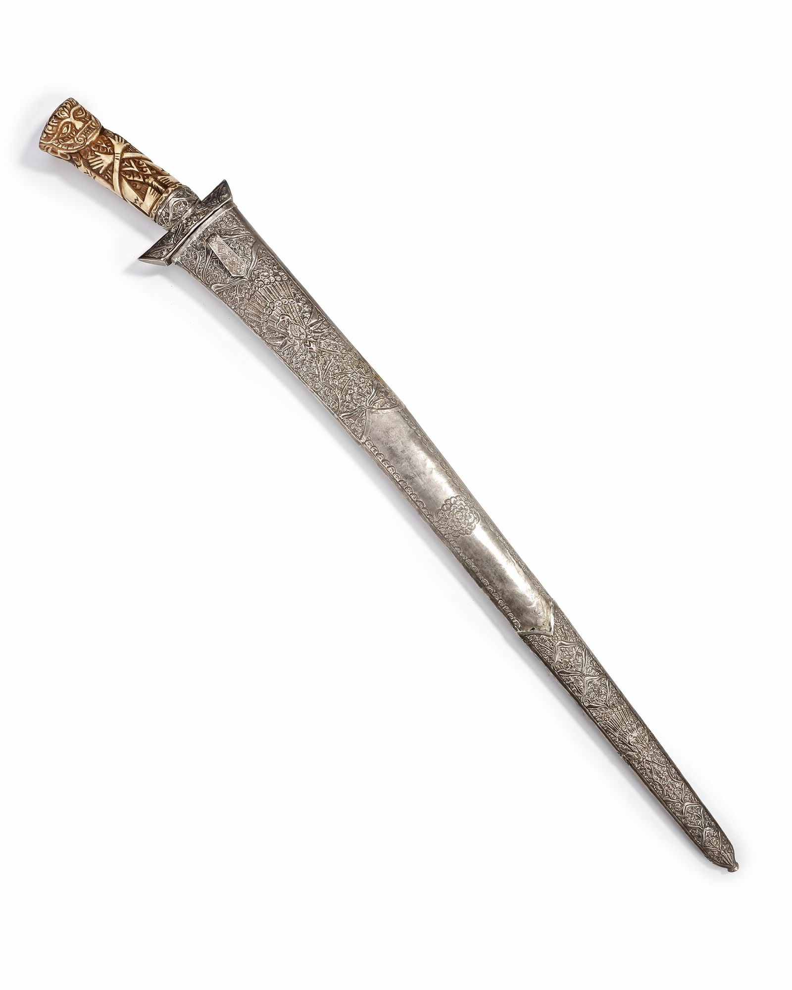 A SILVER SWORD, MALAYSIA, 19TH CENTURY: Featuring a finely engraved scabbard decorated with floral and bird motifs, including a striking peacock design. The hilt is intricately carved from bone in the form of a stylized figure. 66 cm. 672 g
