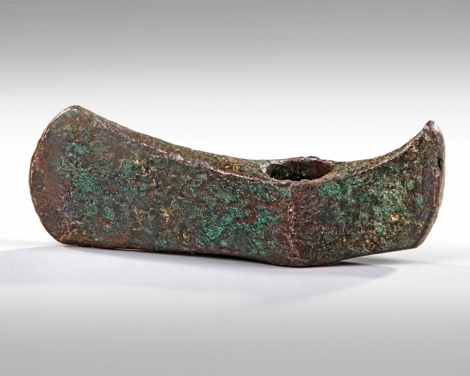A BRONZE SOCKET AXE, LATE BRONZE AGE, 1300 - 800 BC (1 of 3)
