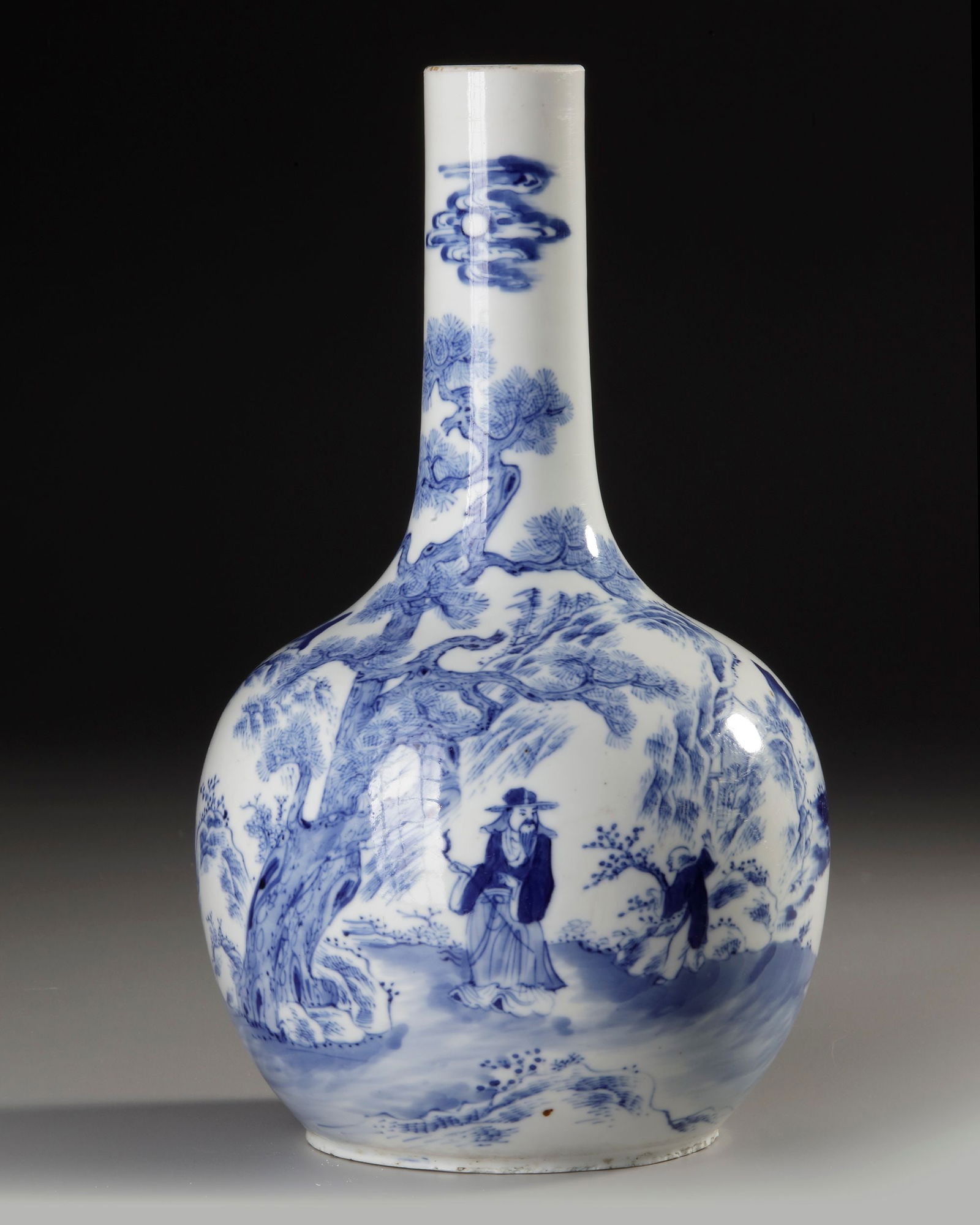 A CHINESE BLUE AND WHITE VASE, QING DYNASTY (1644-1911): A finely painted Qing Dynasty blue-and-white vase, decorated with an elegant scholar-in-landscape scene . H. 28 cm.