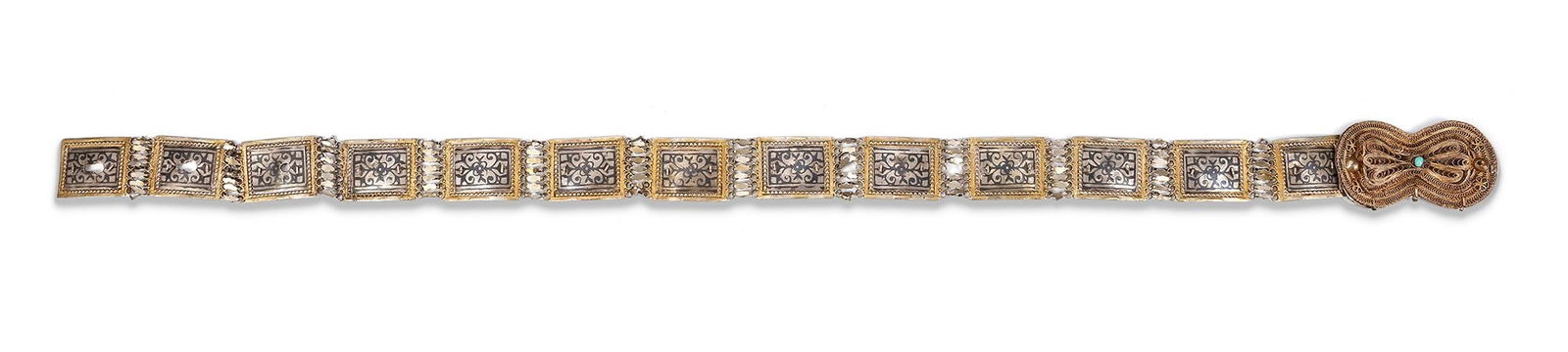 SILVER CAUCASIAN BELT â€“ 19th CENTURY: A finely crafted 19th-century Caucasian silver belt, featuring rectangular panels with intricate openwork floral motifs framed in gold detailing. The clasp is richly decorated with delicate filigree a