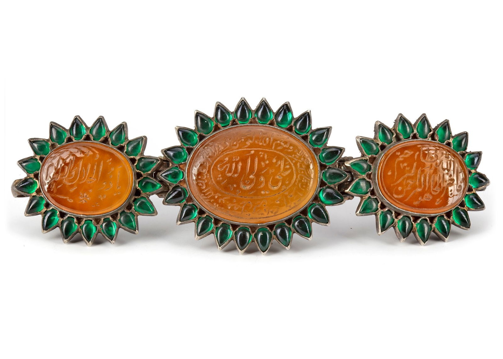 A MUGHAL TALISMANIC BAZUBAND, INDIA, 19TH CENTURY: Comprising three rounded panels of agate stones, each engraved with lines of Naskh or Nasta'liq script, set in a hinged silver mount with cusped edges and backs, boldly engraved with flowers and furth