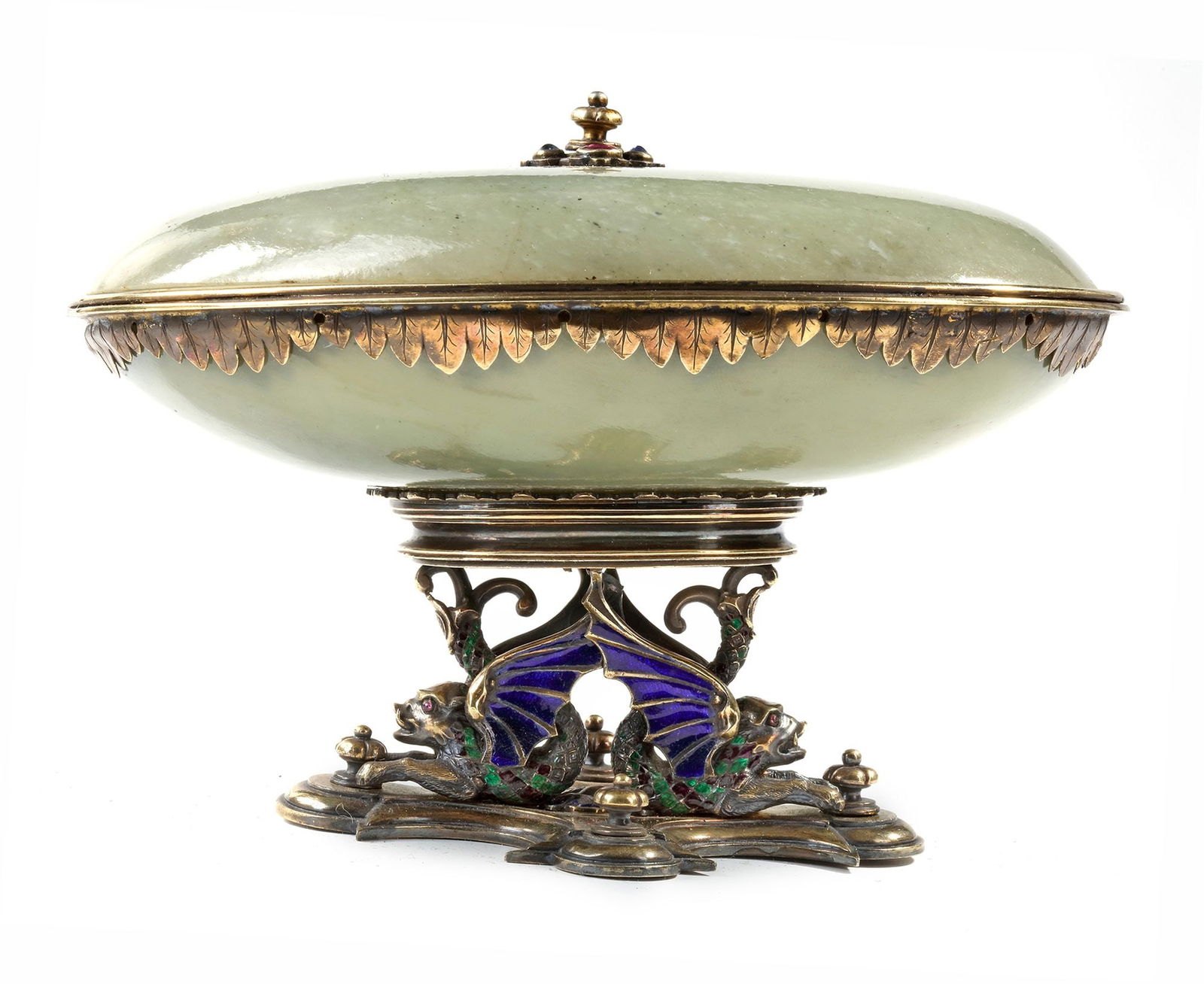 A MUGHAL JADE BOWL AND COVER, 18TH CENTURY: Supported on a later silver gilt and enamel stand modelled as two dragons. Width: 15.5 cm. Height: 11 cm.