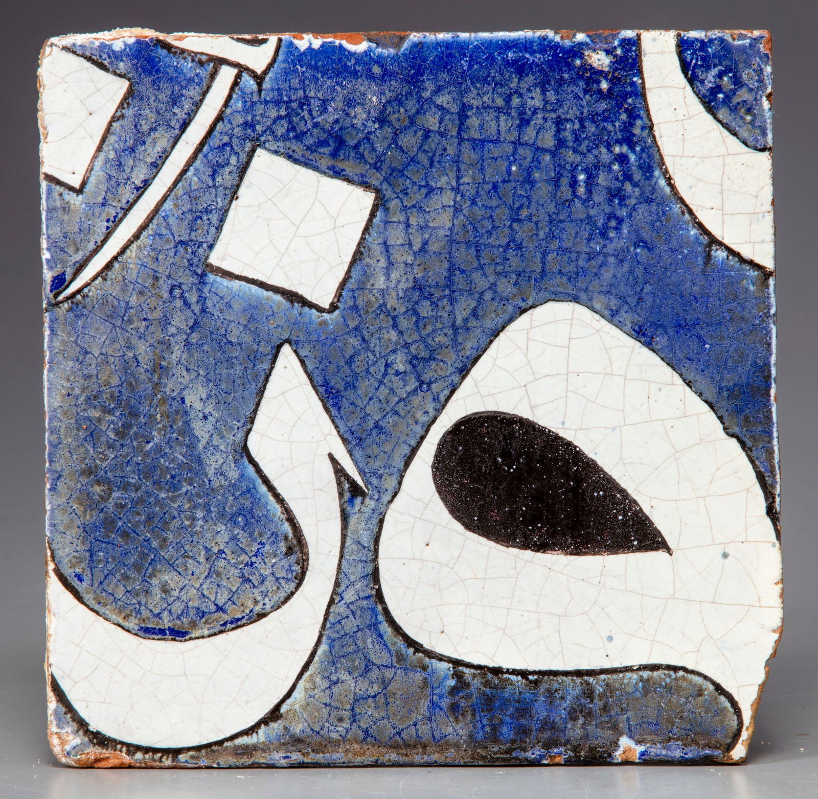 A SAFAVID CUERDA SECA POTTERY TILE, PERSIA, 17TH CENTURY (1 of 2)