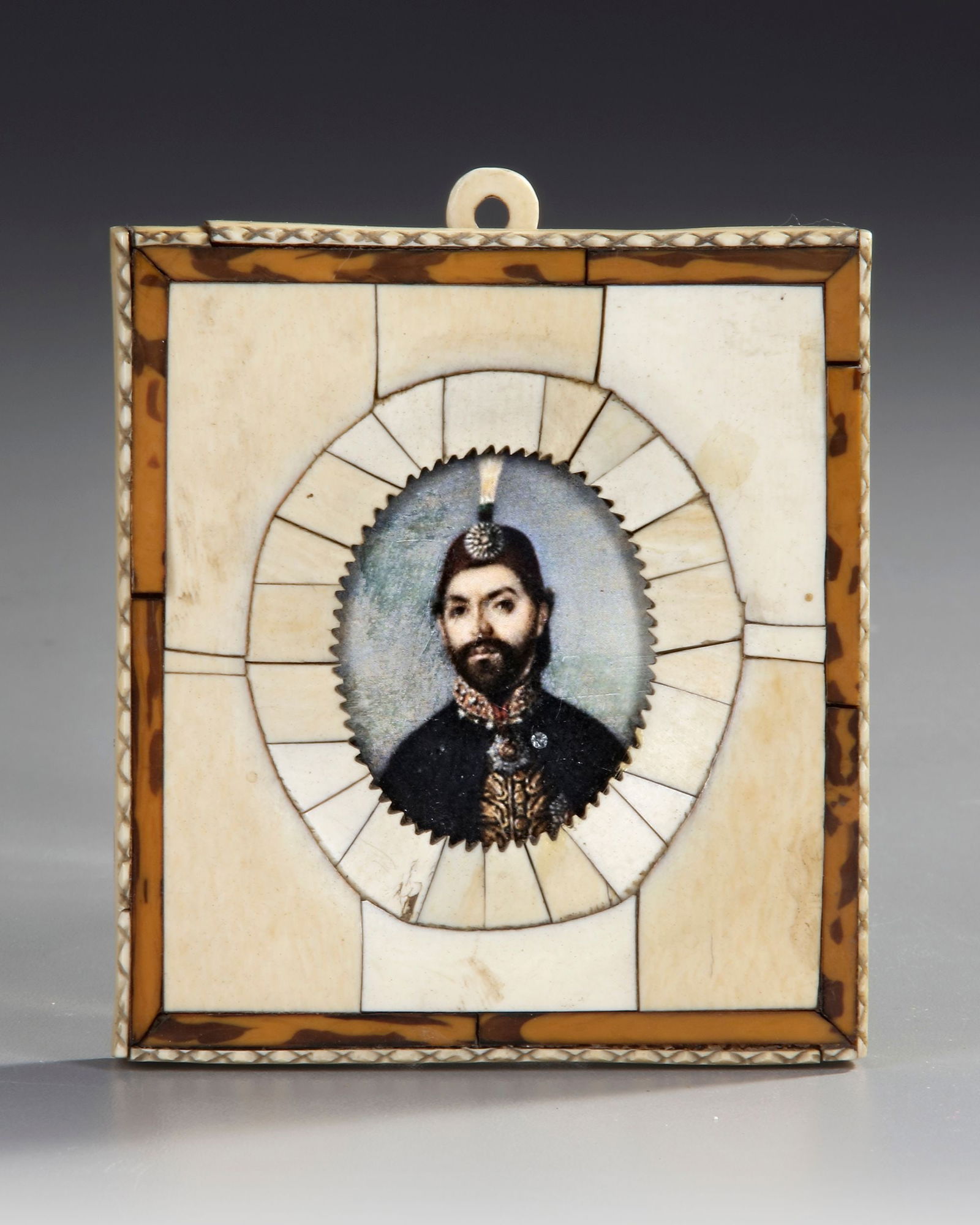 AN OTTOMAN FRAMED PICTURE OF ABDULMECID, 19TH CENTURY: An Ottoman picture frame surrounded by tortoiseshell bordersDimensions: 9,5 by 8,5cm.Condition: good