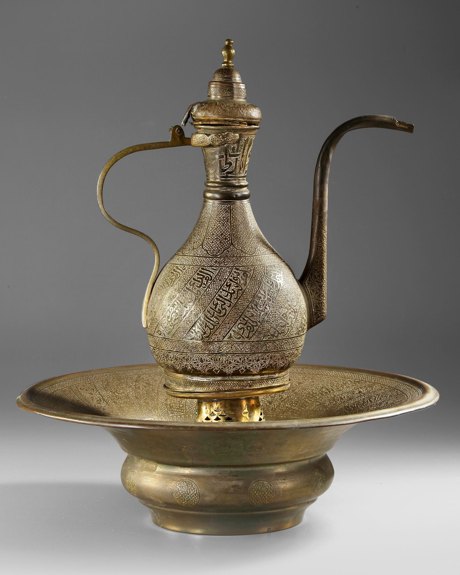 AN OTTOMAN BRASS EWER AND BASIN, 18TH-19TH CENTURY (1 of 2)