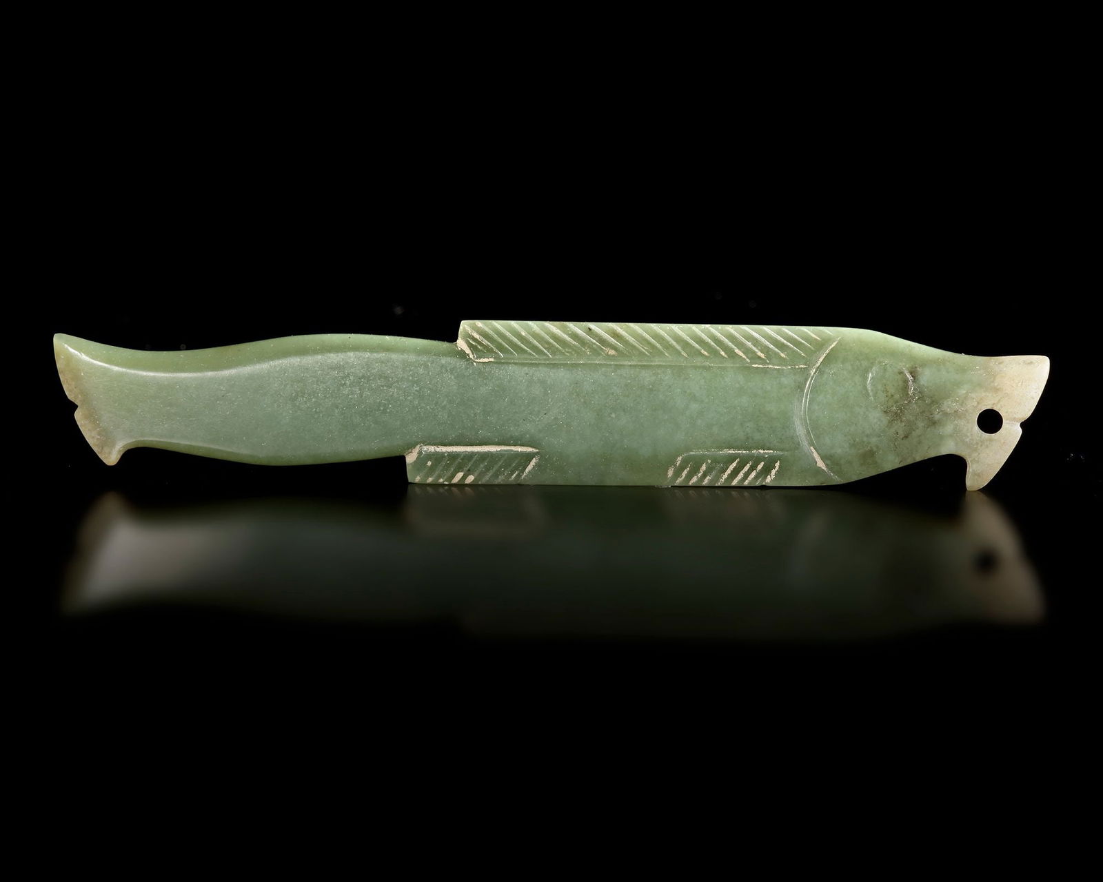 A GREEN JADE FISH PENDANT, SHANG DYNASTY, (c. 1600â€“1046 BC). (1 of 2)