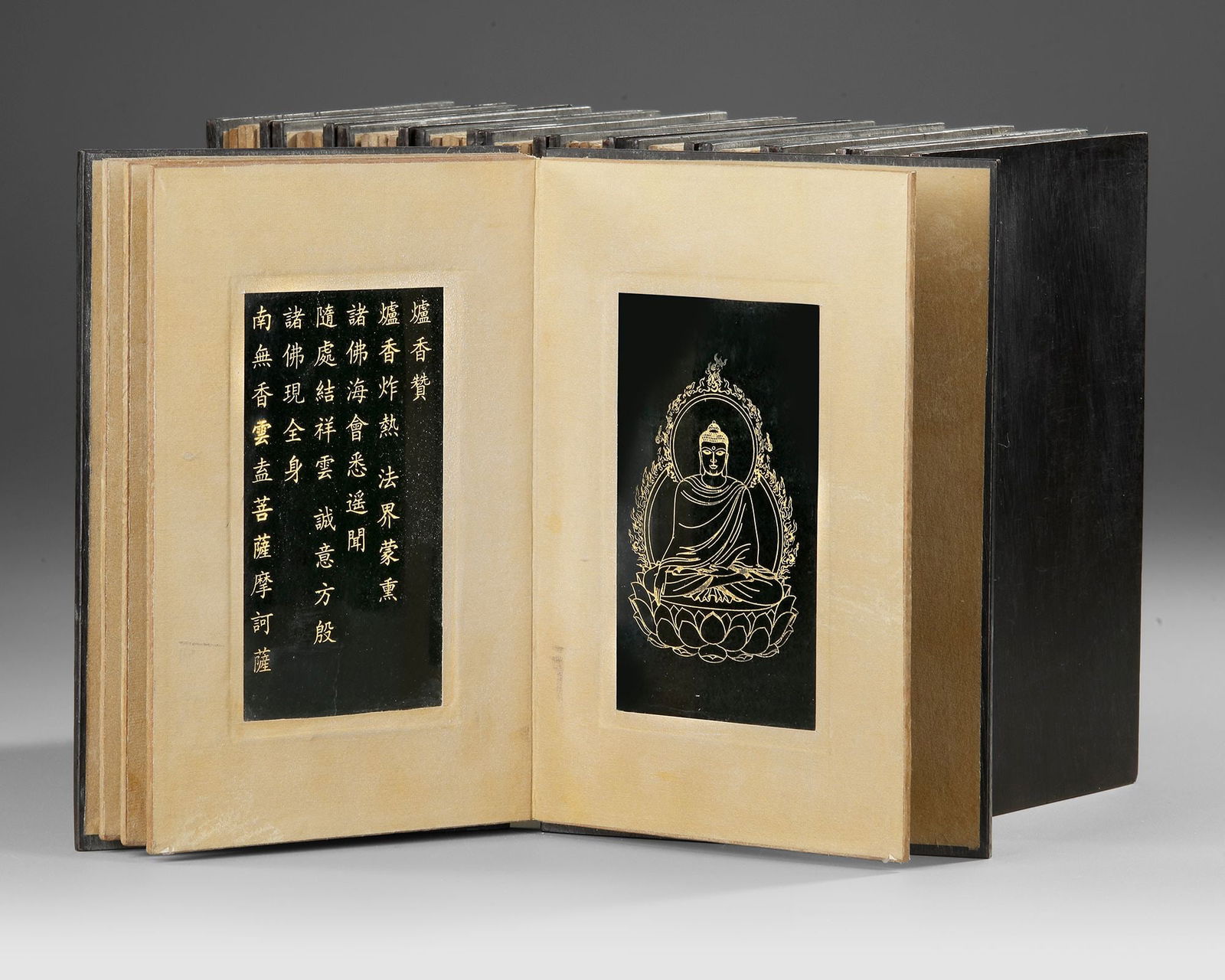 JADE BUDDHIST SUTRA BOOK â€“ QING DYNASTY (1644â€“1912): A rare Buddhist sutra book carved from jade, consisting of eleven rectangular pages engraved with finely cut Chinese characters. Each tablet is worked recto and verso, presenting sacred Buddhist scrip