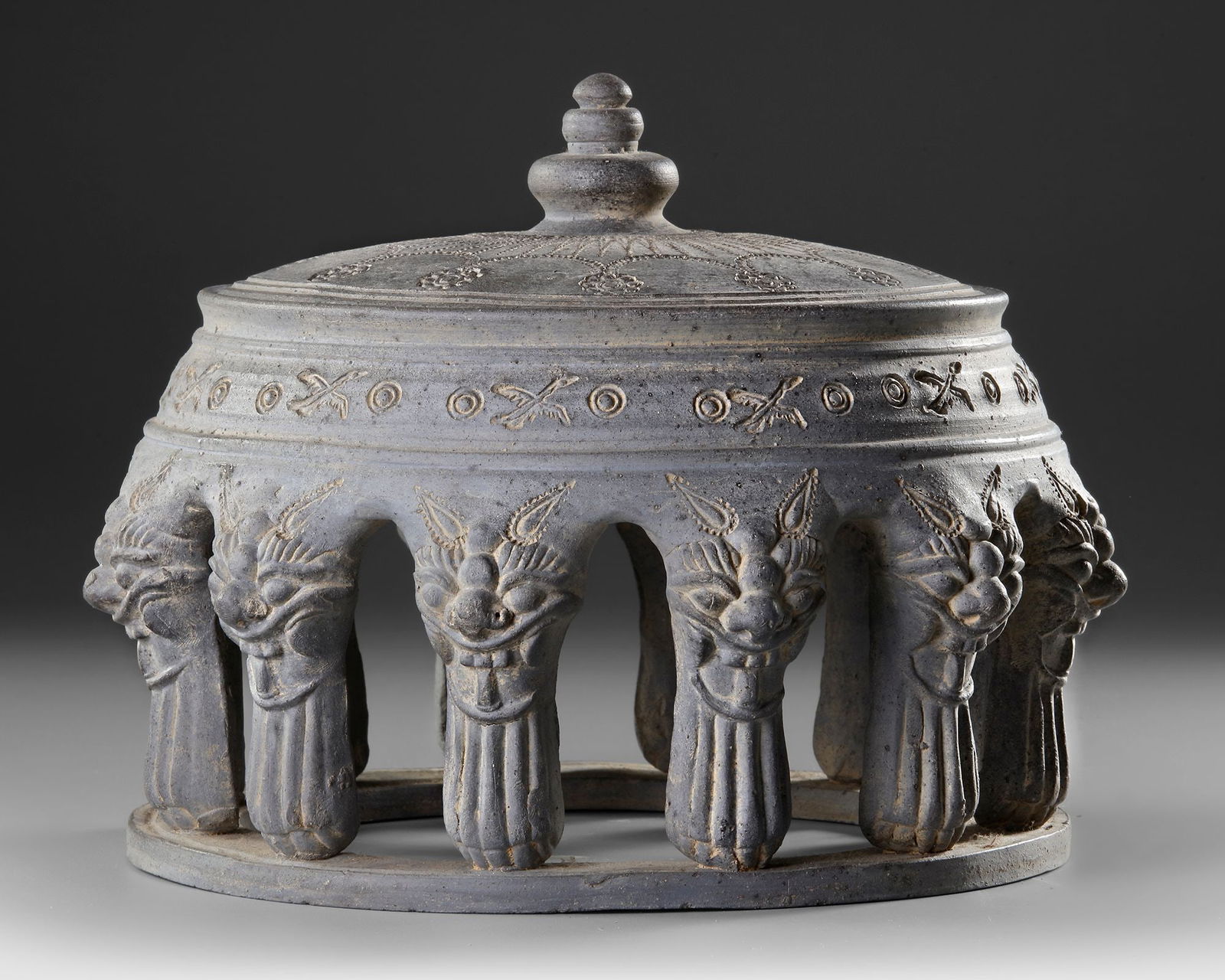 A CERAMIC INKSTONE, BAEKJE KINGDOM OF KOREA (18 BC-660 AD): This rare ceramic inkstone originates from the renowned for refined artistry and cultural exchange across East Asia. The piece features a circular structure supported by sculpted decorative pillars wi