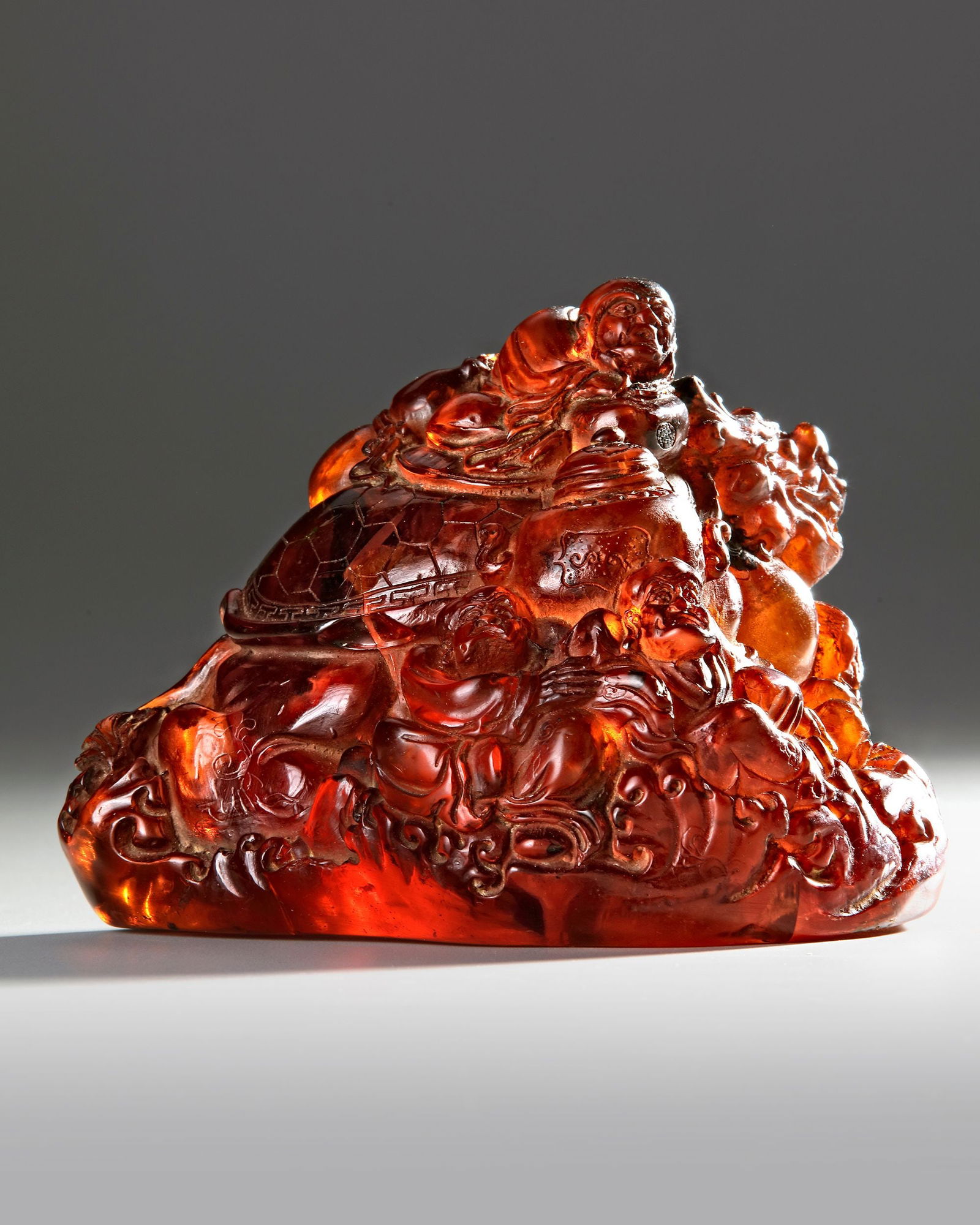 AN AMBER BOULDER CARVING, CHINA, QING DYNASTY (1644-1912) (1 of 2)