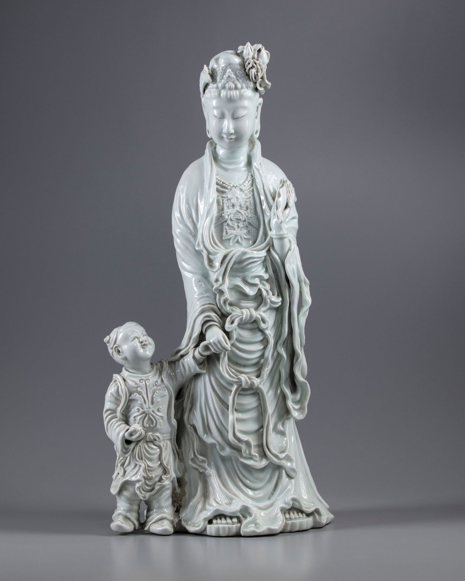 AN EXCEPTIONAL LARGE DEHUA GLAZED FIGURE OF A GUANYIN WITH A CHILD, 20TH CENTURY (1 of 6)
