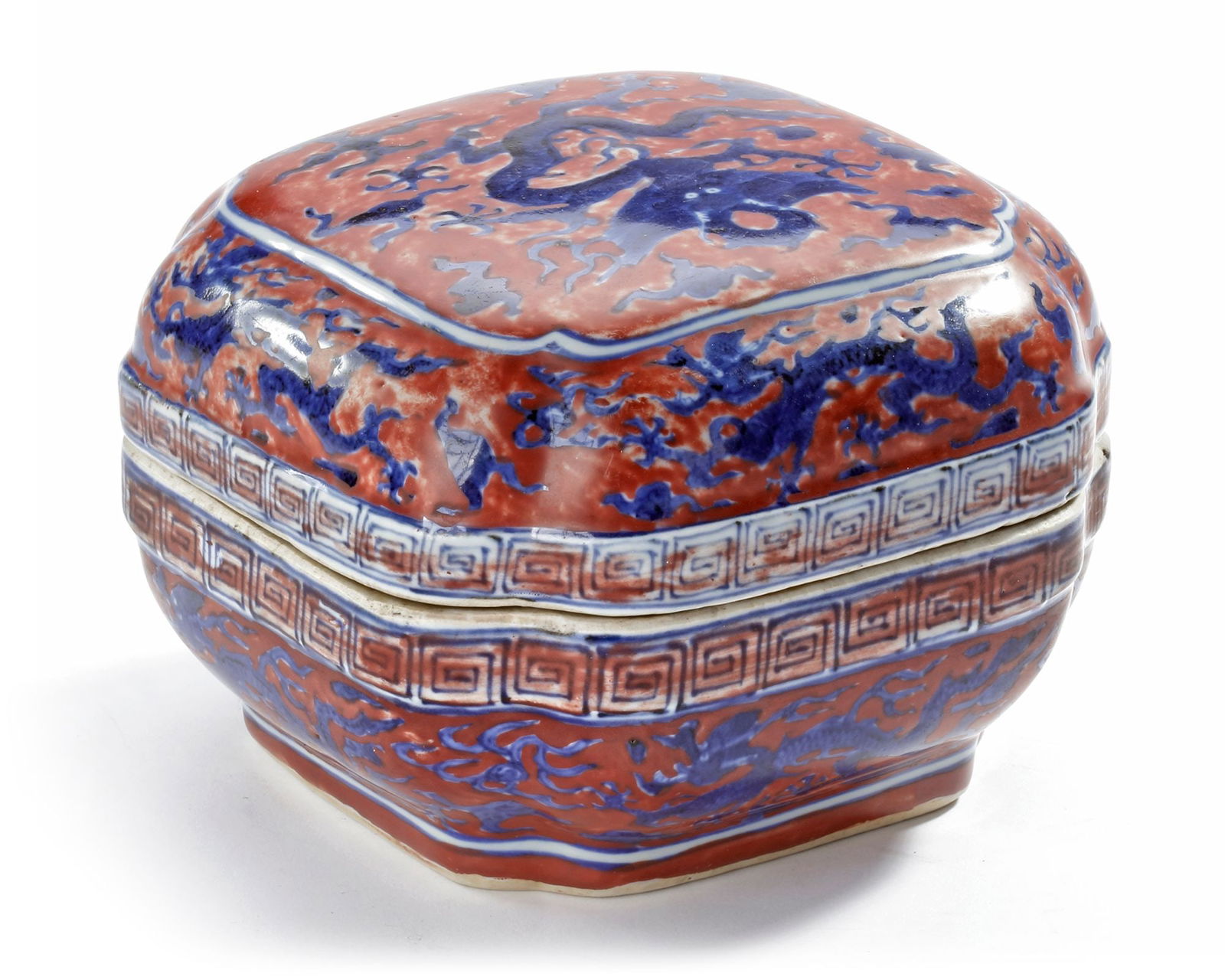 A CHINESE IRON-RED-GROUND BLUE AND WHITE DRAGON BOX, QING DYNASTY (1644-1911) (1 of 4)