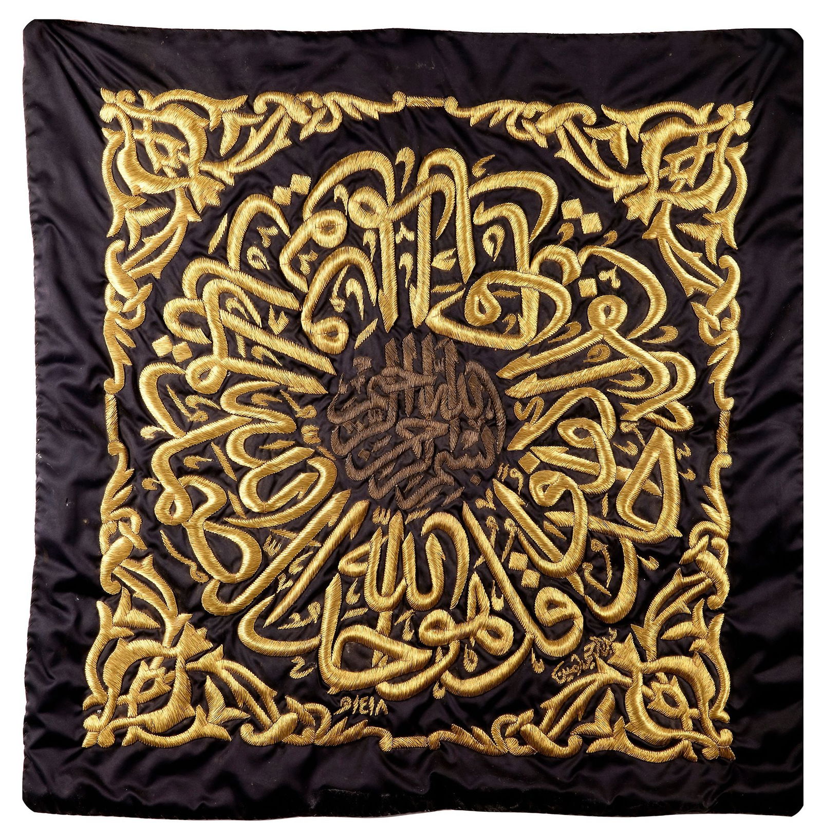 A GILT METAL-THREAD EMBROIDERED KISWAH FRAGMENT, MADE FOR THE HOLY KA'BA, SAUDIA ARABIA 20TH CENTURY: Of square form, embroidered in gilt-metal and silver thread on black ground with a central roundel incorporating the bismallah, encircled by an inscription in thuluth, the corners decorated with arabe