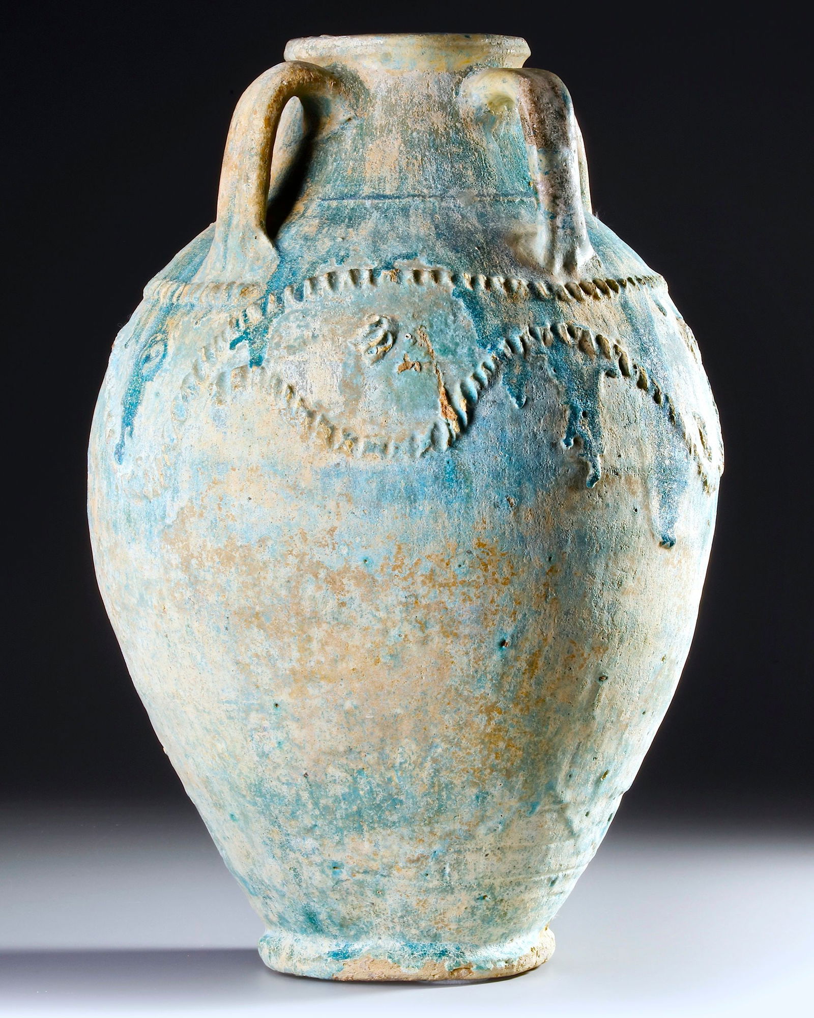 A POST SASSANIAN TURQUOISE GLAZED POTTERY STORAGE JAR, PERSIA OR IRAQ, 7TH-8TH CENTURY (1 of 4)