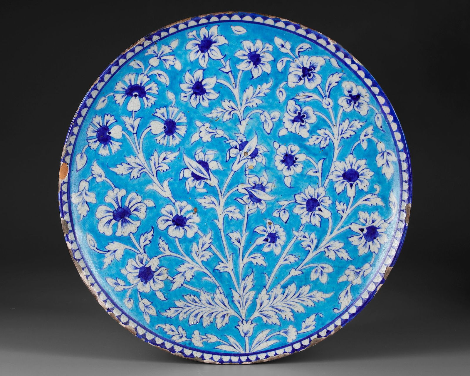 AN INDIAN MULTAN TIN GLAZED EARTHENWARE CHARGER, 19TH CENTURY: ca. 44 cm.