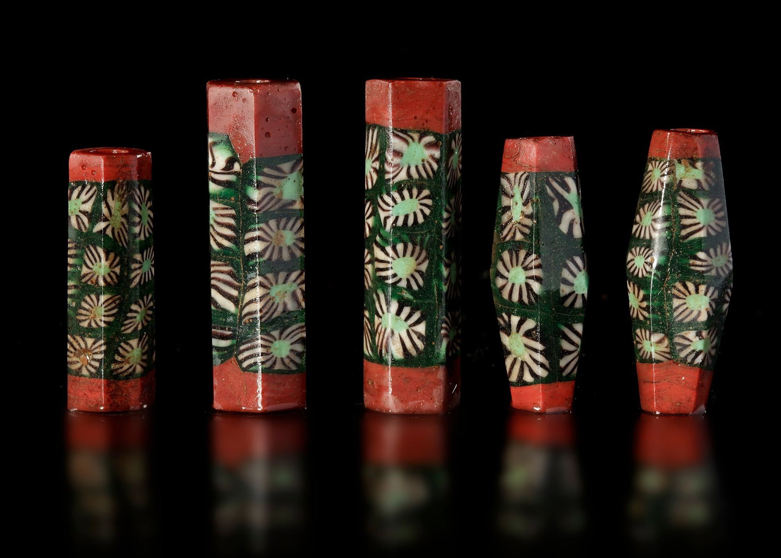 FIVE EARLY ISLAMIC GLASS BEADS SYRIA, 900â€“1200 AD (1 of 3)