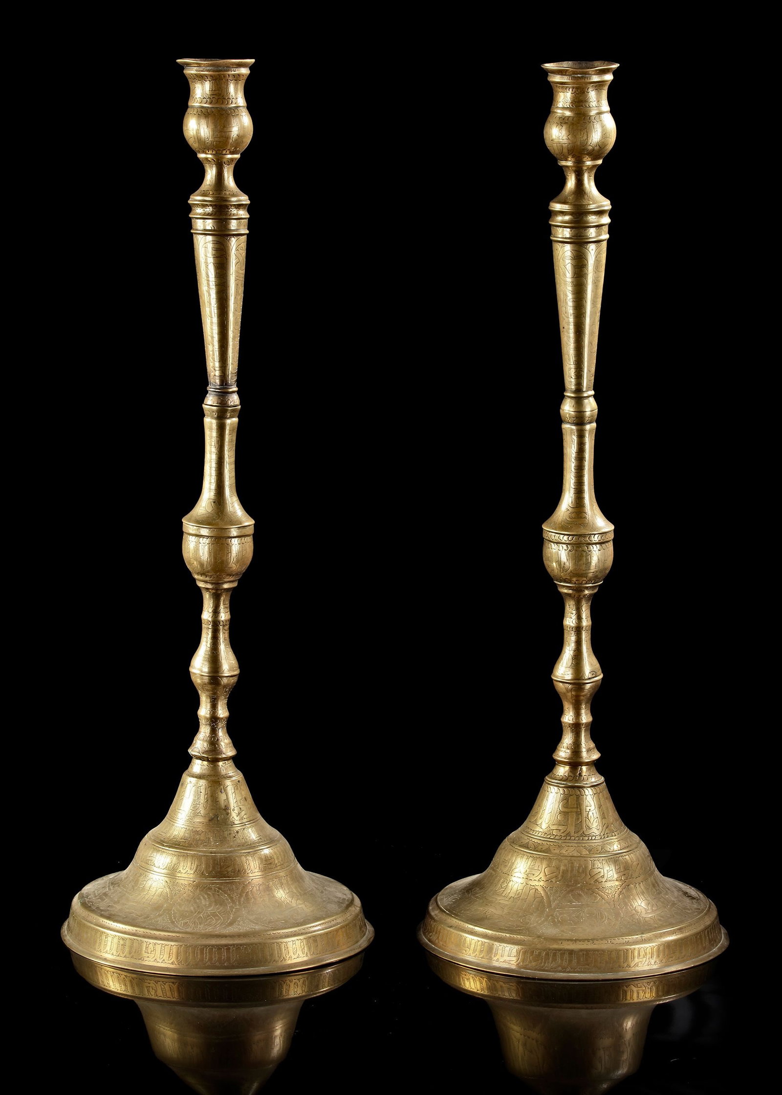 A PAIR OF LARGE QAJAR ENGRAVED BRASS CANDLESTICKS, PERSIA, 19TH CENTURY (1 of 4)