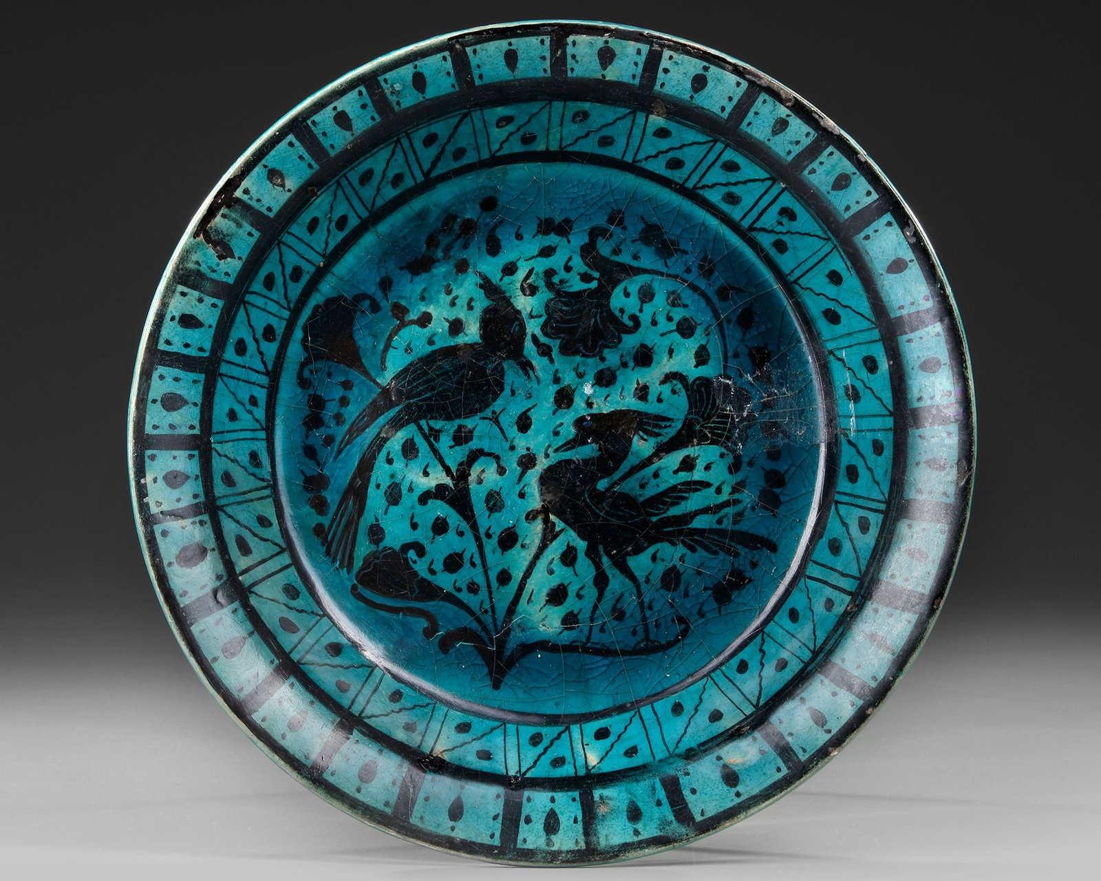 A RAQQA TURQUOISE-GLAZED POTTERY DISH, SYRIA, EARLY 13TH CENTURY (1 of 4)