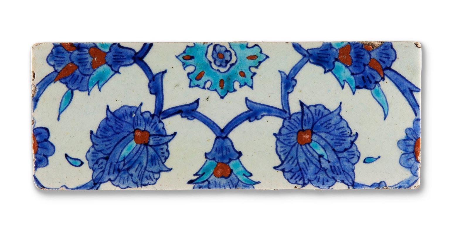 AN OTTOMAN IZNK POTTERY TILE FRAGMENT, TURKEY, 16TH CENTURY (1 of 2)