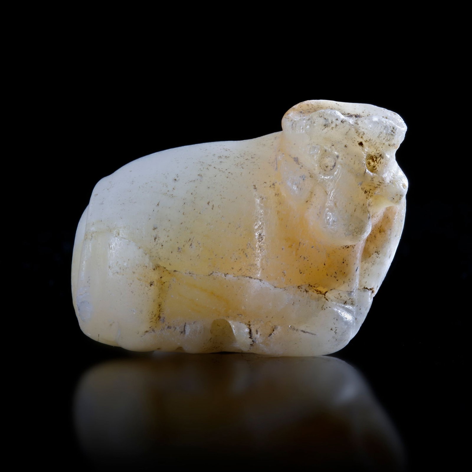 A RECLING BULL SEAL IN CALCITIC LIMESTONE, 3RD MILLENNIUM BC (1 of 5)