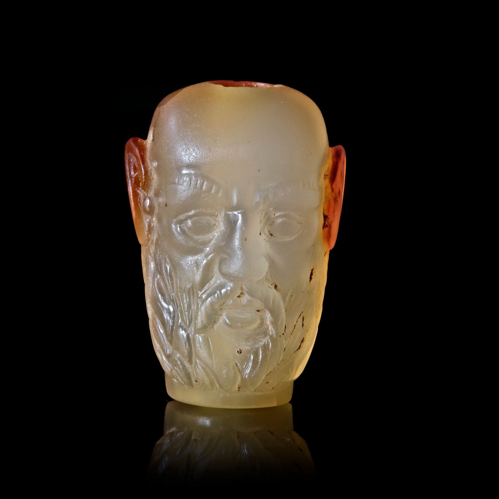 A ROMAN HEAD OF A BARBARIAN OR GAULISH A PALE ORANGE CARNELIAN , 1ST-2ND CENTURY AD (1 of 10)