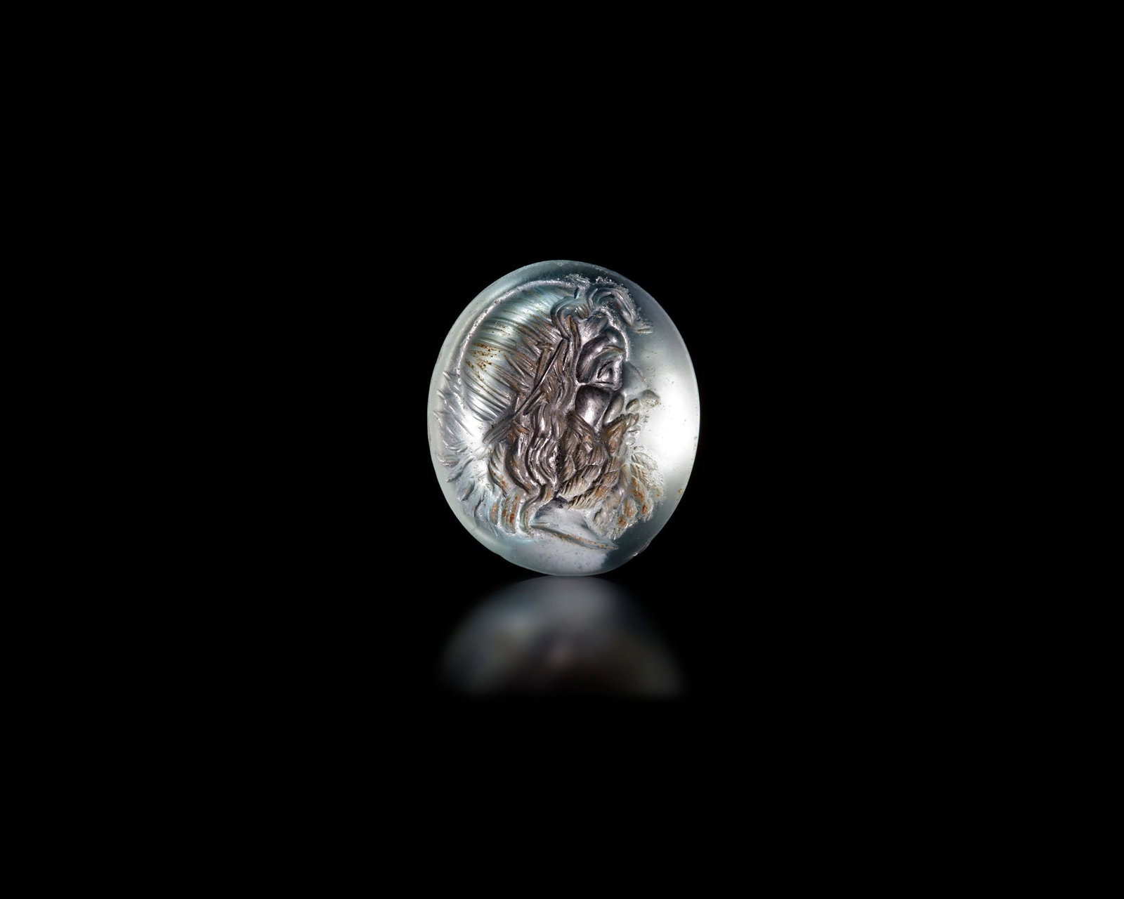 A ROMAN AQUAMARINE INTAGLIO OF POSEIDON, 1ST CENTURY BC-1ST CENTURY AD (1 of 3)