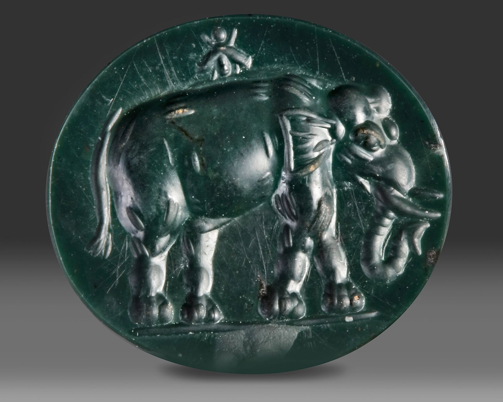 A ROMAN INTAGLIO OF AN ELEPHANT, 1ST CENTURY BC-AD (1 of 4)