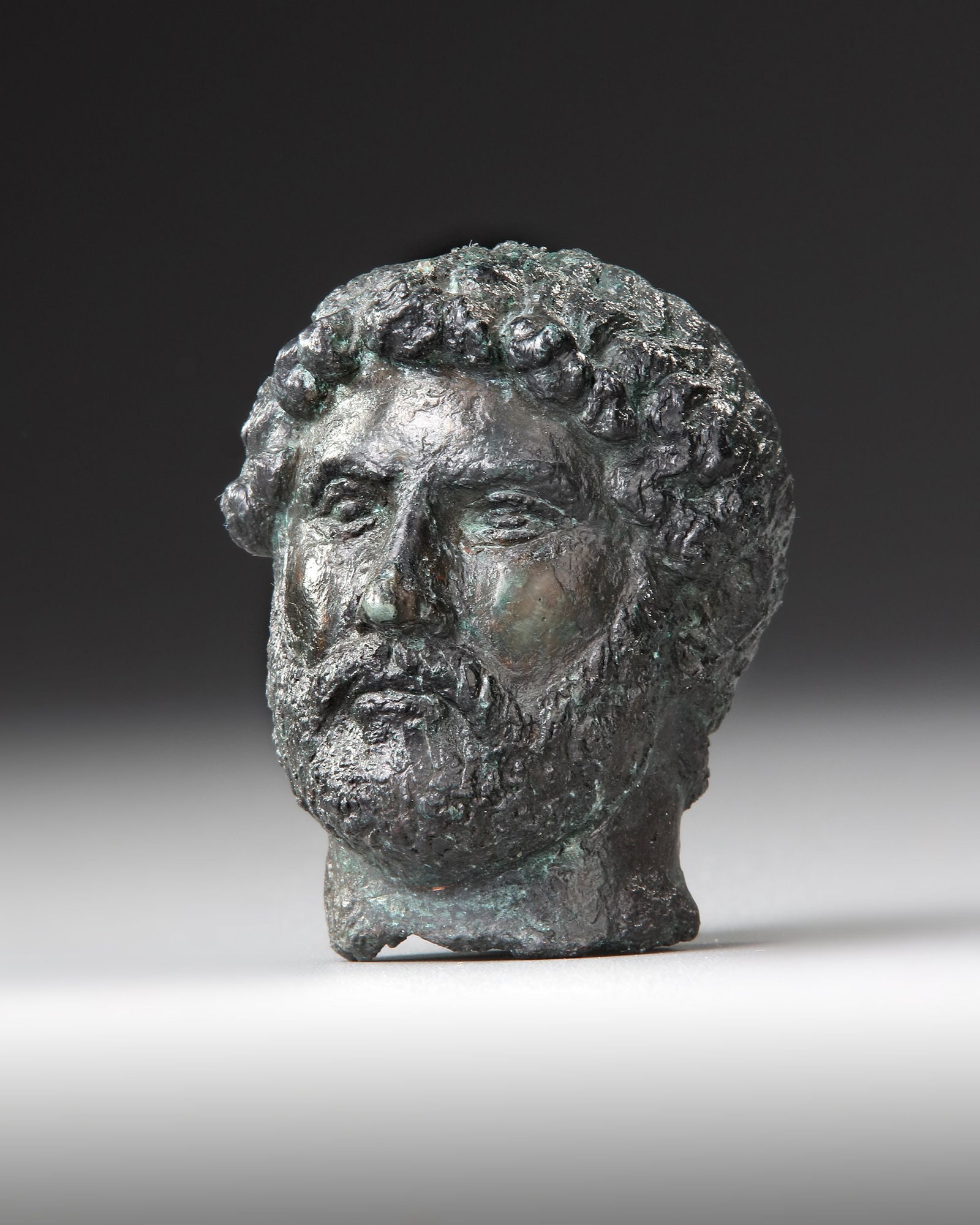 A MINIATURE BRONZE HEAD OF THE EMPEROR HADRIAN, 117-138 AD 2ND CENTURY AD (1 of 10)